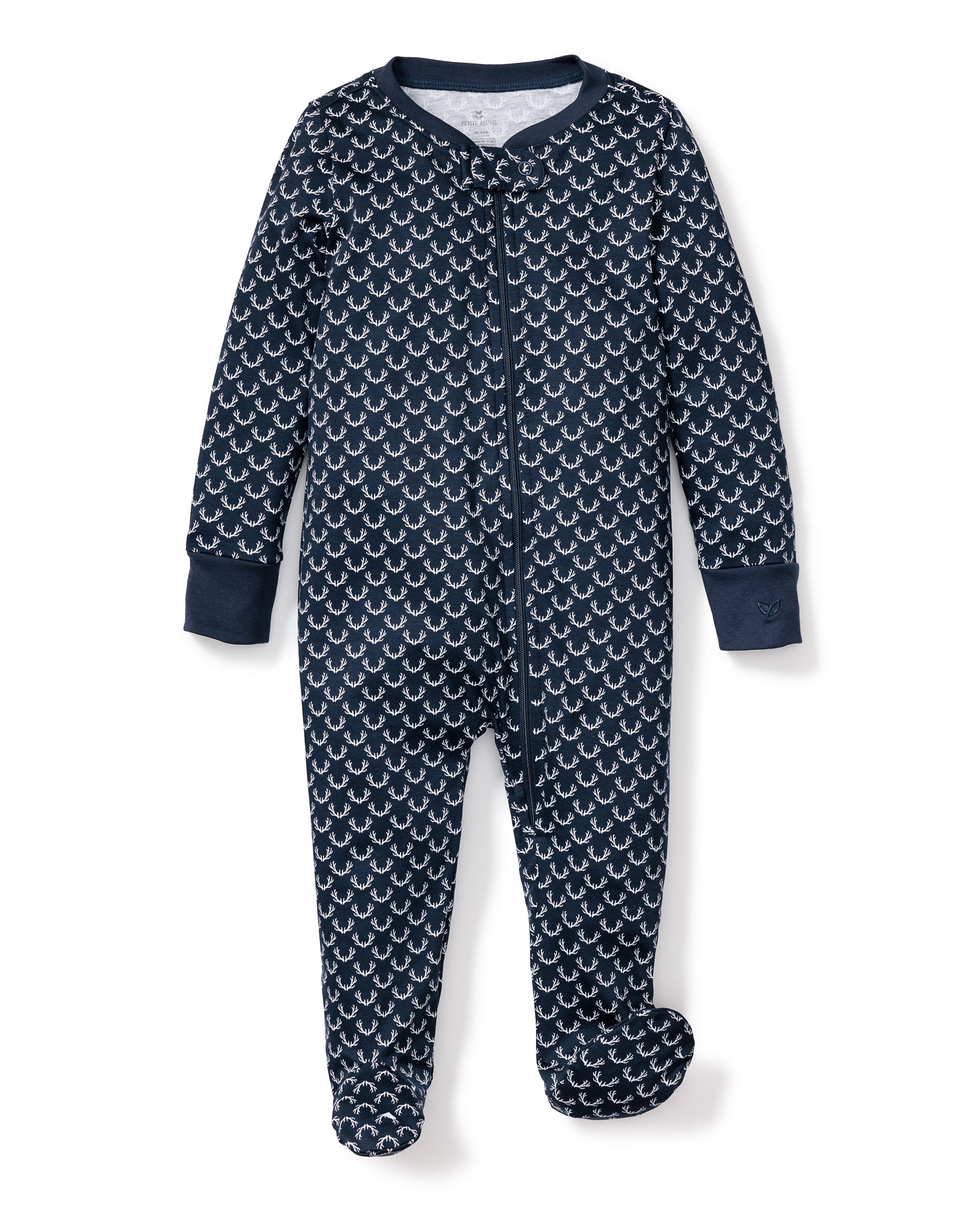 A navy blue footed onesie from Petite Plume, crafted in soft Pima cotton with a white sailboat design. This Babys Pima Romper in Nordic Antlers has long sleeves and a front zipper for cozy wear, warmth, and comfort.