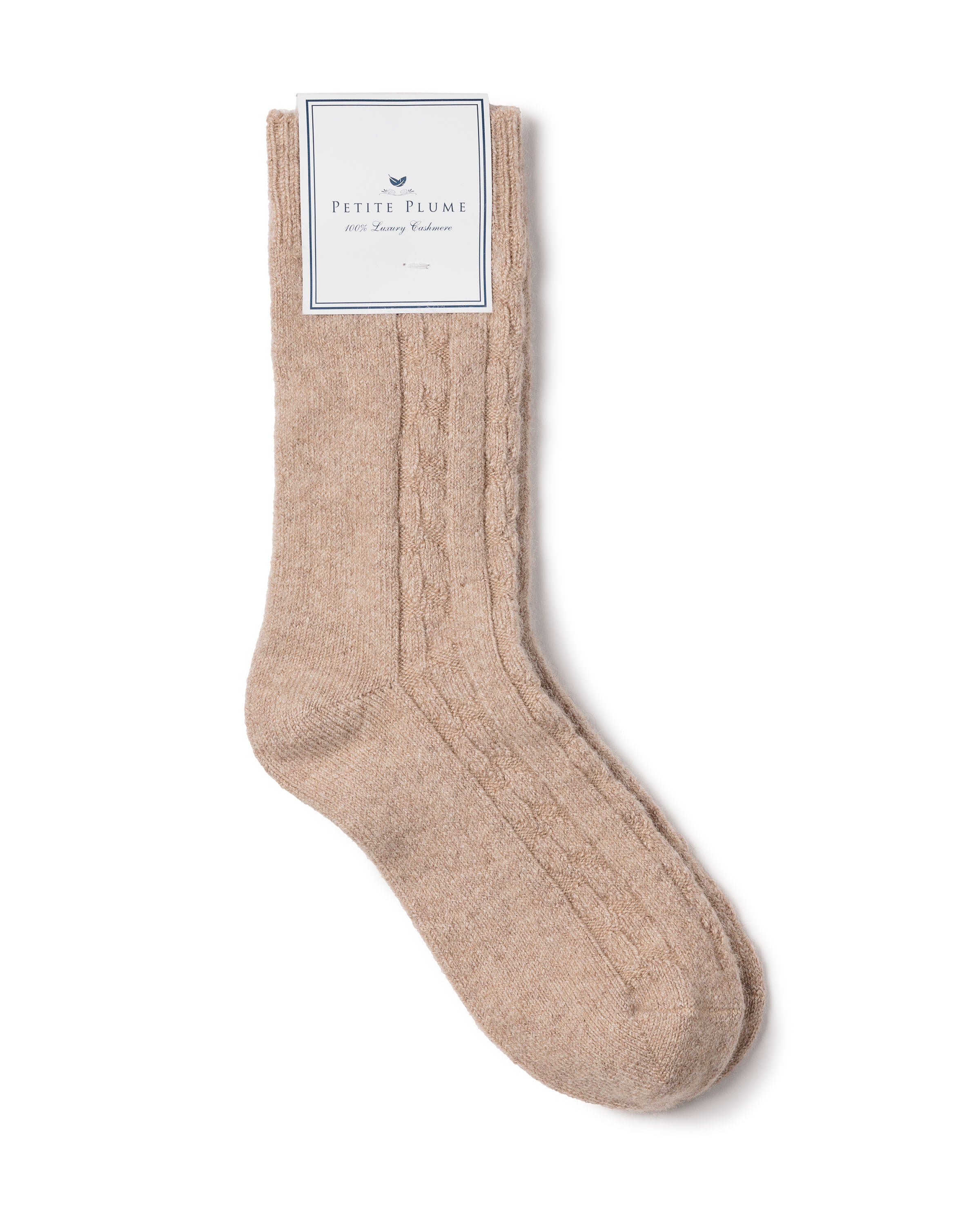 The beige cable-knit Petite Plume Mens Cashmere Socks crafted with premium cashmere epitomize elegance and warmth. Displayed flat on a white background, these luxurious socks offer unmatched comfort.