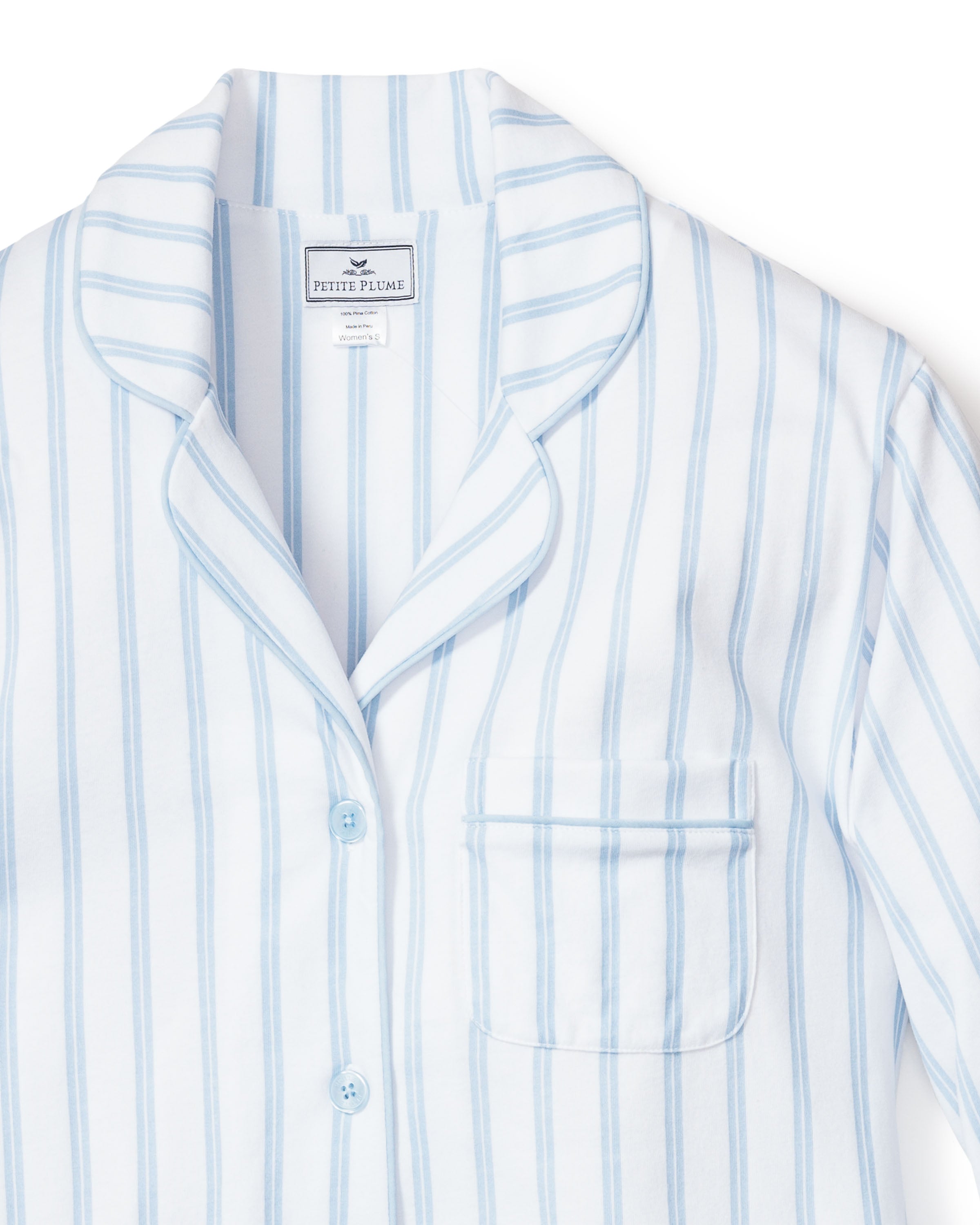 Close-up of Petite Plumes Womens Pima Pajama Set in Periwinkle Stripe, crafted from soft Pima cotton. This luxury pajama top features a collar, buttons, and a left chest pocket.