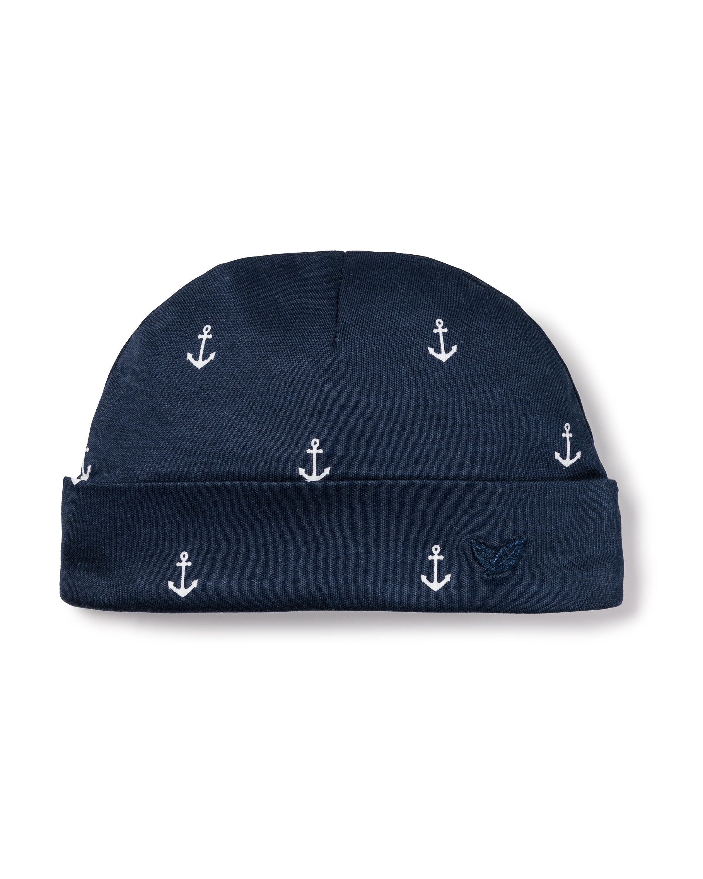 Petite Plumes Babys Pima Hat in Portsmouth Anchors is a navy blue hat featuring small white anchors, a folded brim, and a subtle logo. Made from luxurious Peruvian Pima Cotton, its perfect for completing your babys outfit.