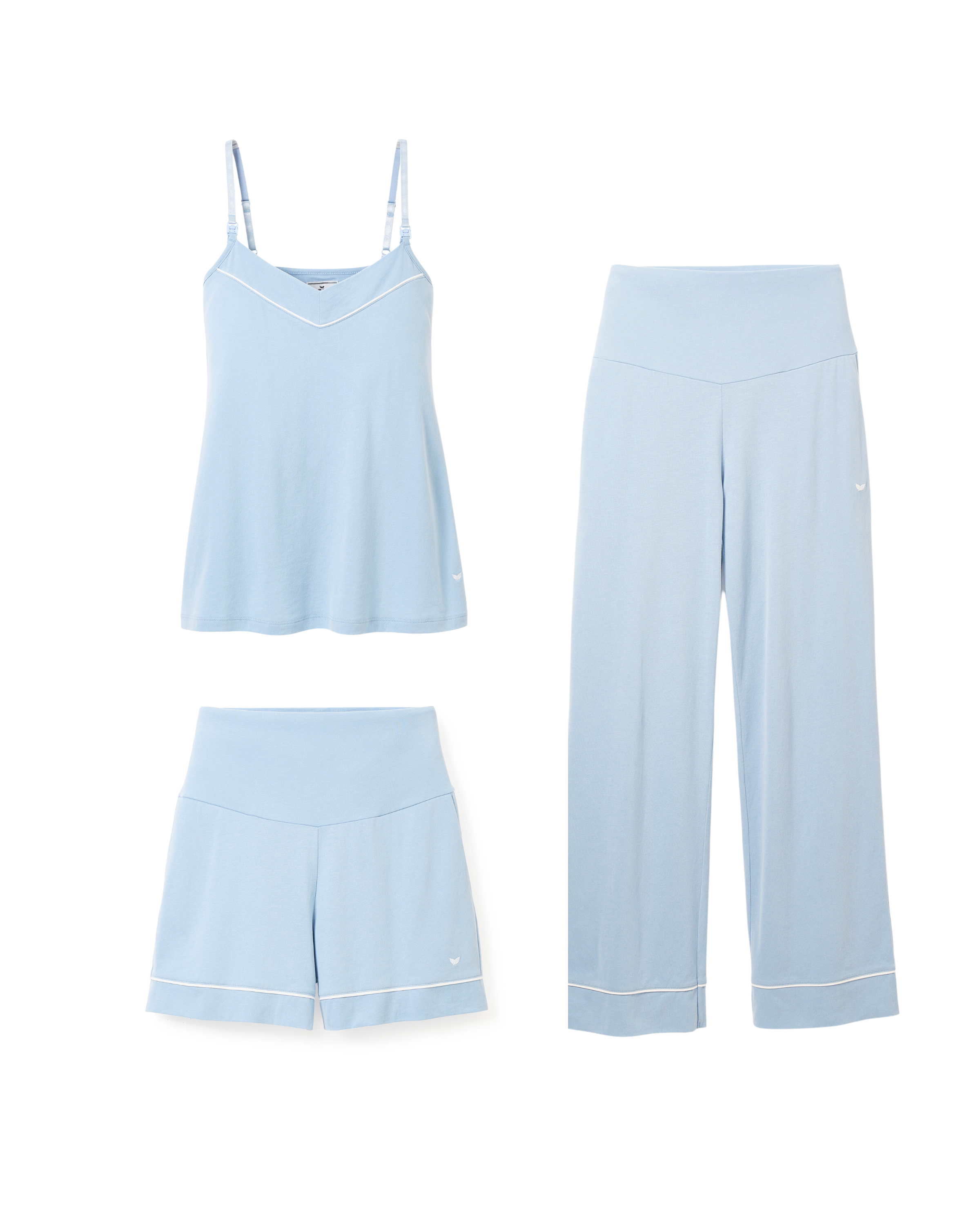 The Basics Maternity Set in Periwinkle by Petite Plume includes a light blue sleeveless top with thin straps and a V-neck, plus maternity-friendly pants and shorts, all crafted from soft Pima cotton. The pants and shorts have wide waistbands with subtle white piping.