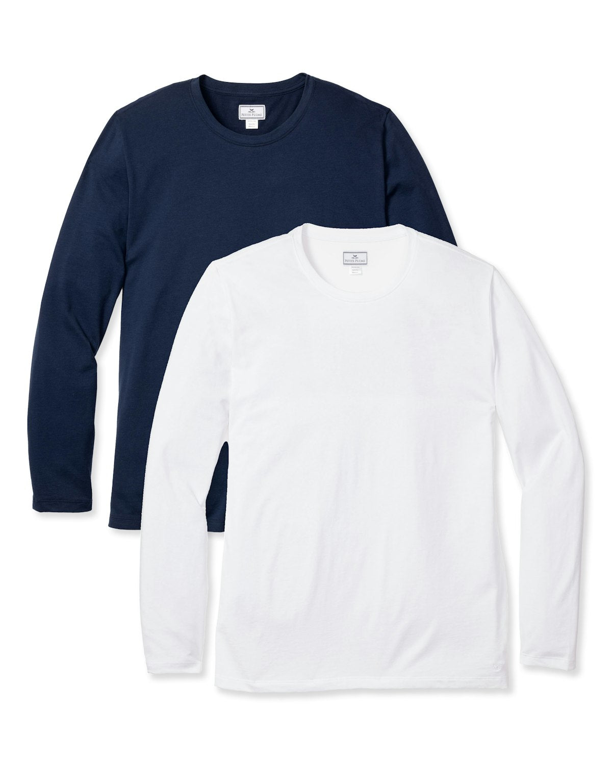 The Men’s Pima Long Sleeve T-shirt Duo by Petite Plume features two shirts—one navy blue and one white. Crafted from soft Peruvian Pima cotton, both shirts have a simple, classic design with crew necklines, making them perfect for your bedtime ritual.