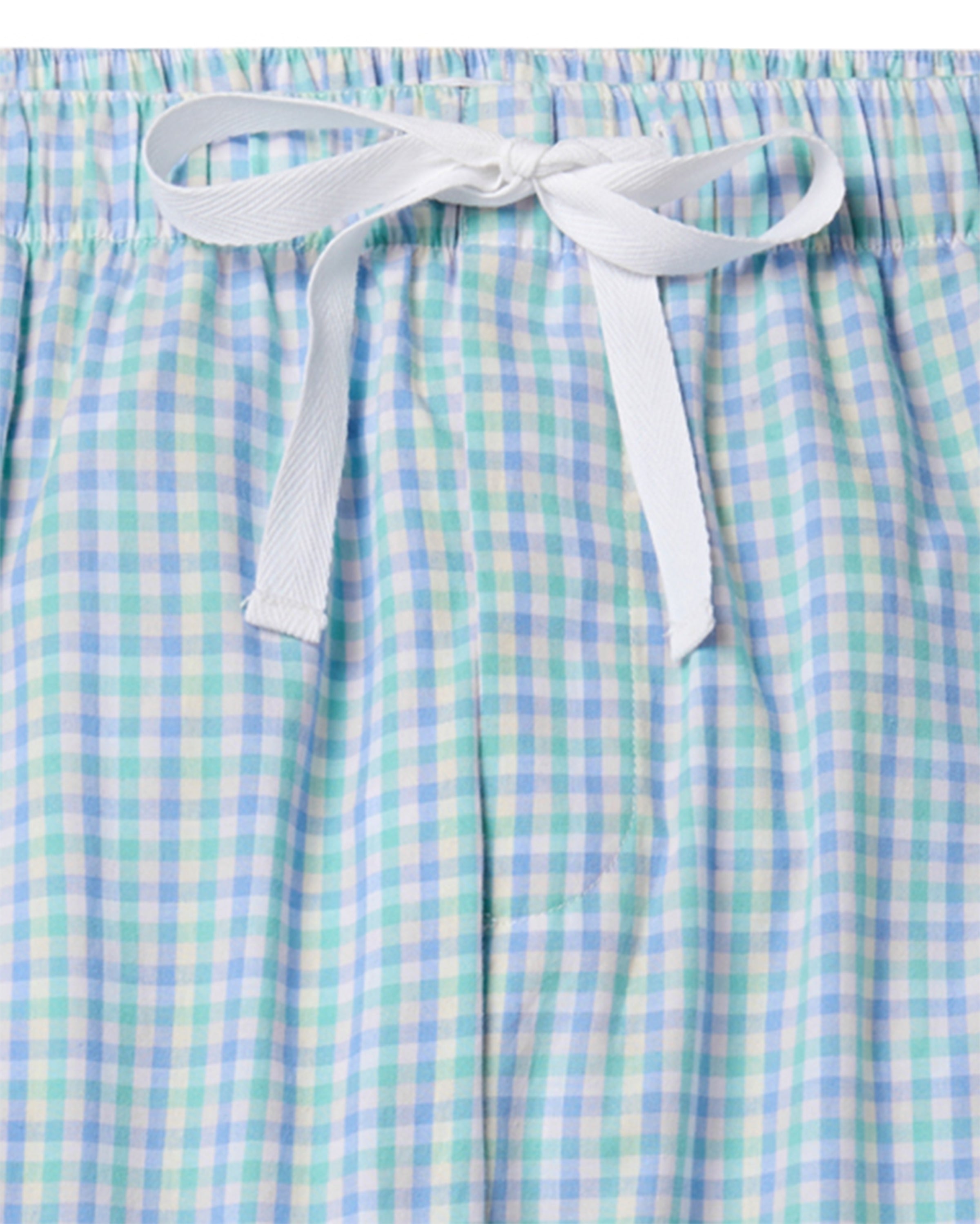 Close-up of Petite Plumes Mens Twill Pajama Pants in Spring Gingham, showcasing a light blue and white gingham pattern with a white drawstring bow, crafted from premium cotton.