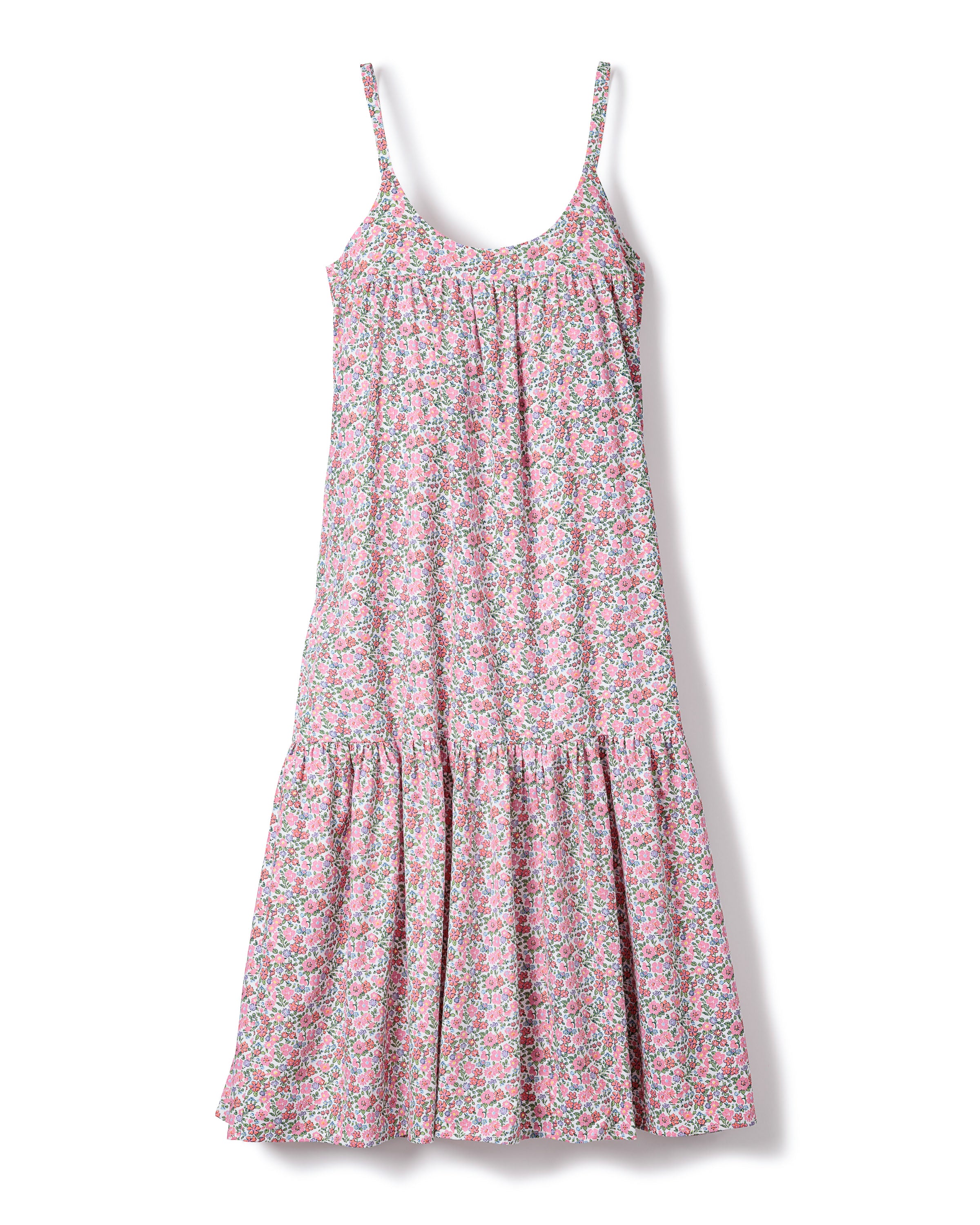 A sleeveless dress with thin straps, featuring a multicolored Fleurs de Rose floral print. Crafted from high-quality cotton, the Womens Twill Chloe Nightgown by Petite Plume boasts a relaxed, flowing fit with a gathered, ruffled hem.