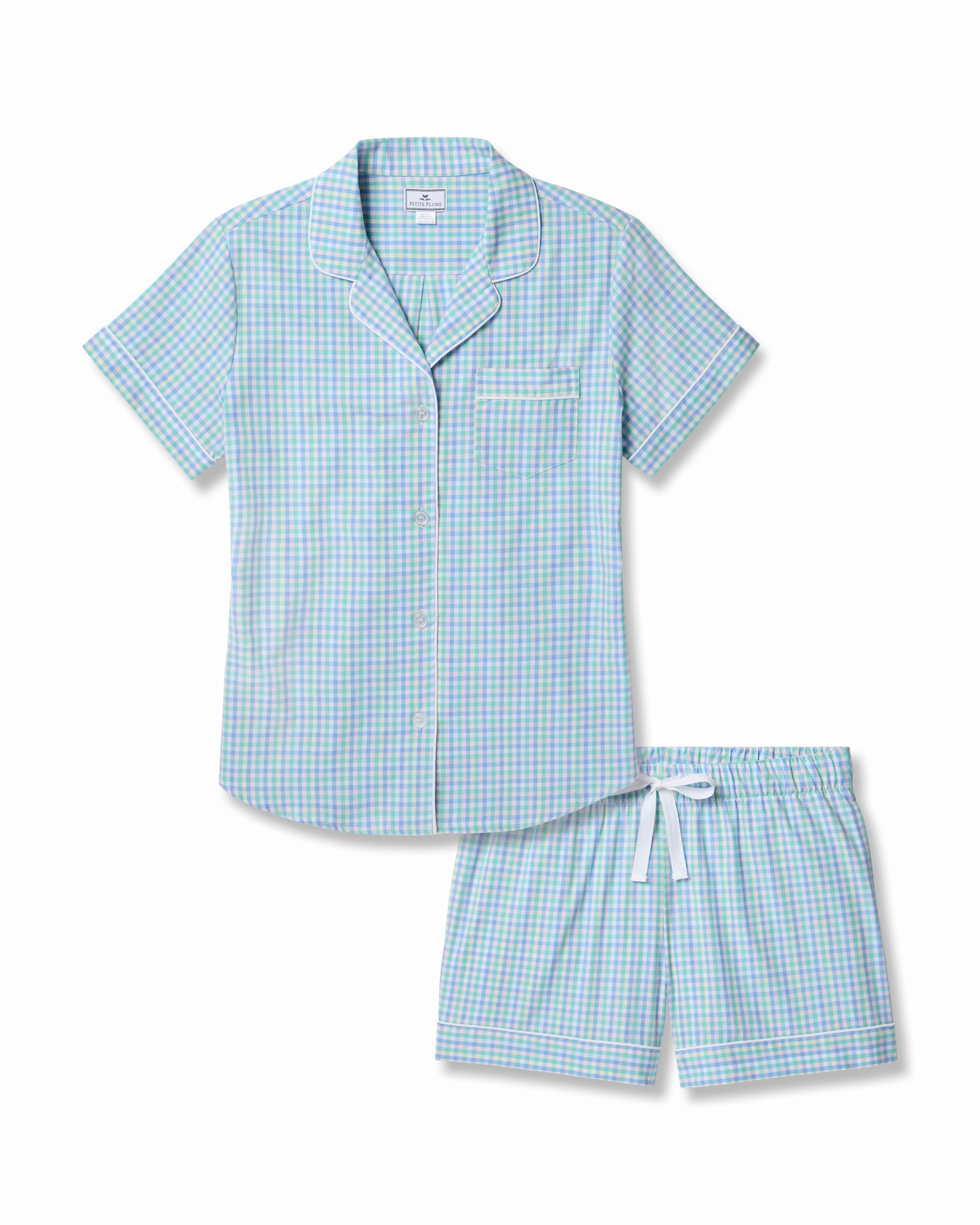 Indulge in luxury with the Womens Twill Short Sleeve Short Set in Spring Gingham by Petite Plume, featuring a blue and green gingham design. Made from premium cotton, this set includes a button-up top with white piping and chest pocket, plus matching shorts with a white drawstring for superior comfort.