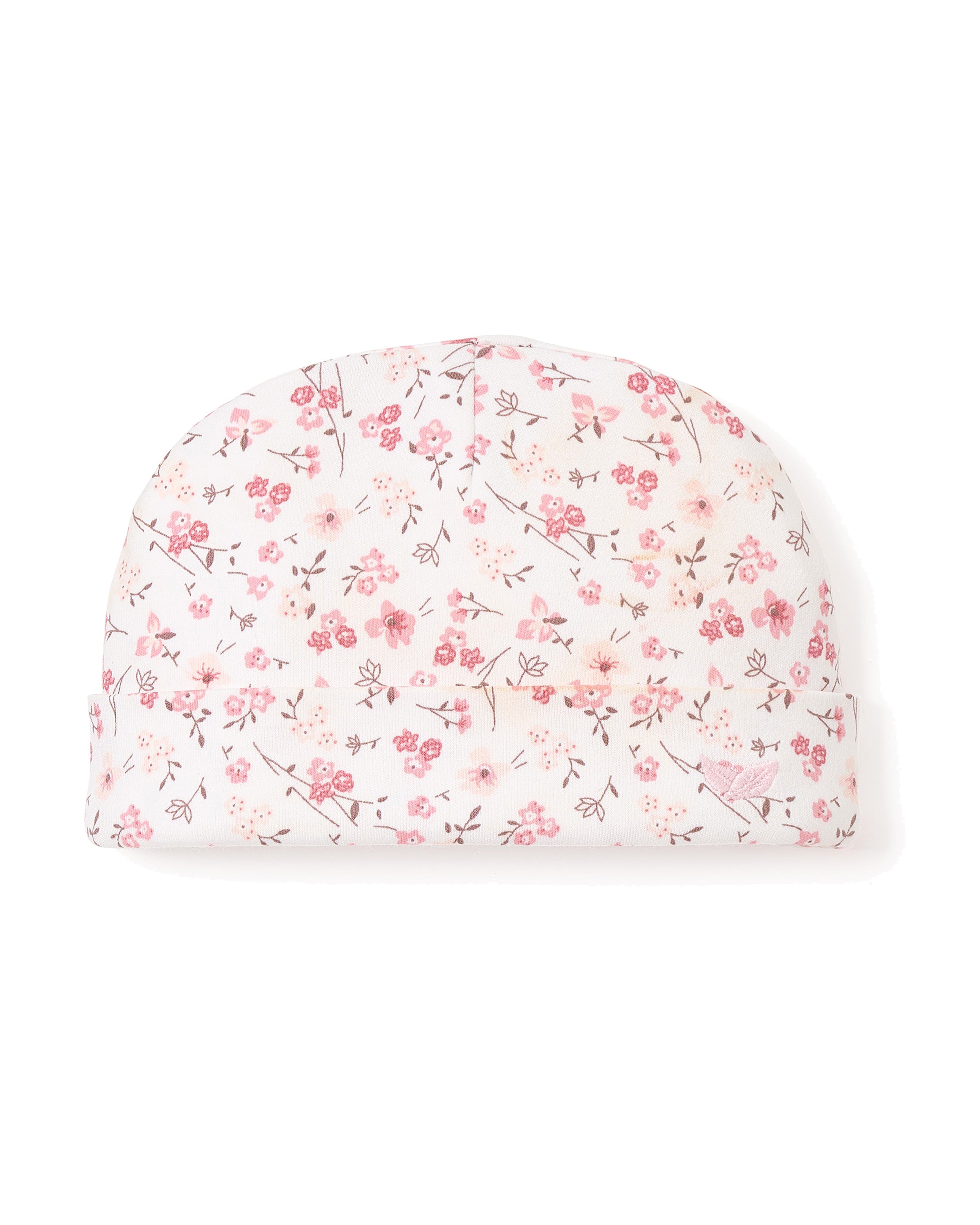 The Babys Pima Hat in Dorset Floral by Petite Plume is crafted from luxurious Peruvian Pima Cotton, featuring a charming pattern of pink flowers and tiny birds. Its soft texture is perfect for your babys delicate skin.