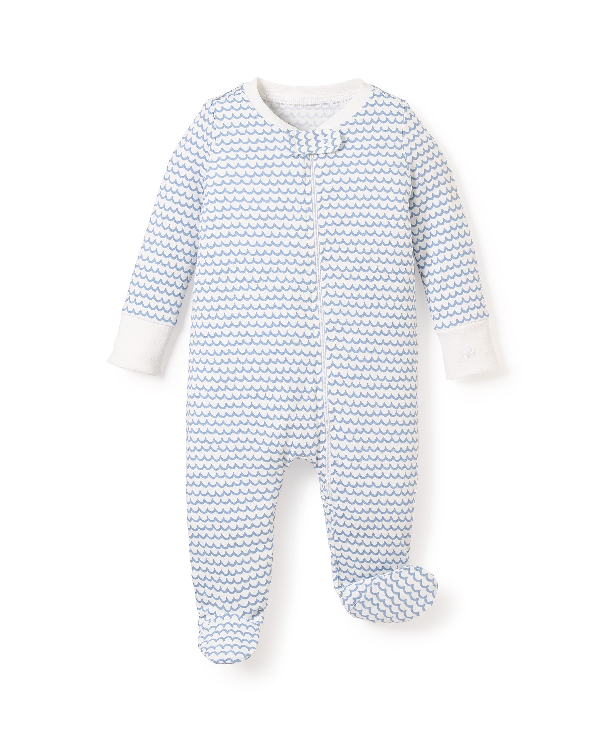 The Babys Pima Romper in La Mer by Petite Plume is made from 100% Pima cotton. It features a footed design with small blue waves on a white background, complemented by a white zipper and matching cuffs to keep your baby cozy all day.