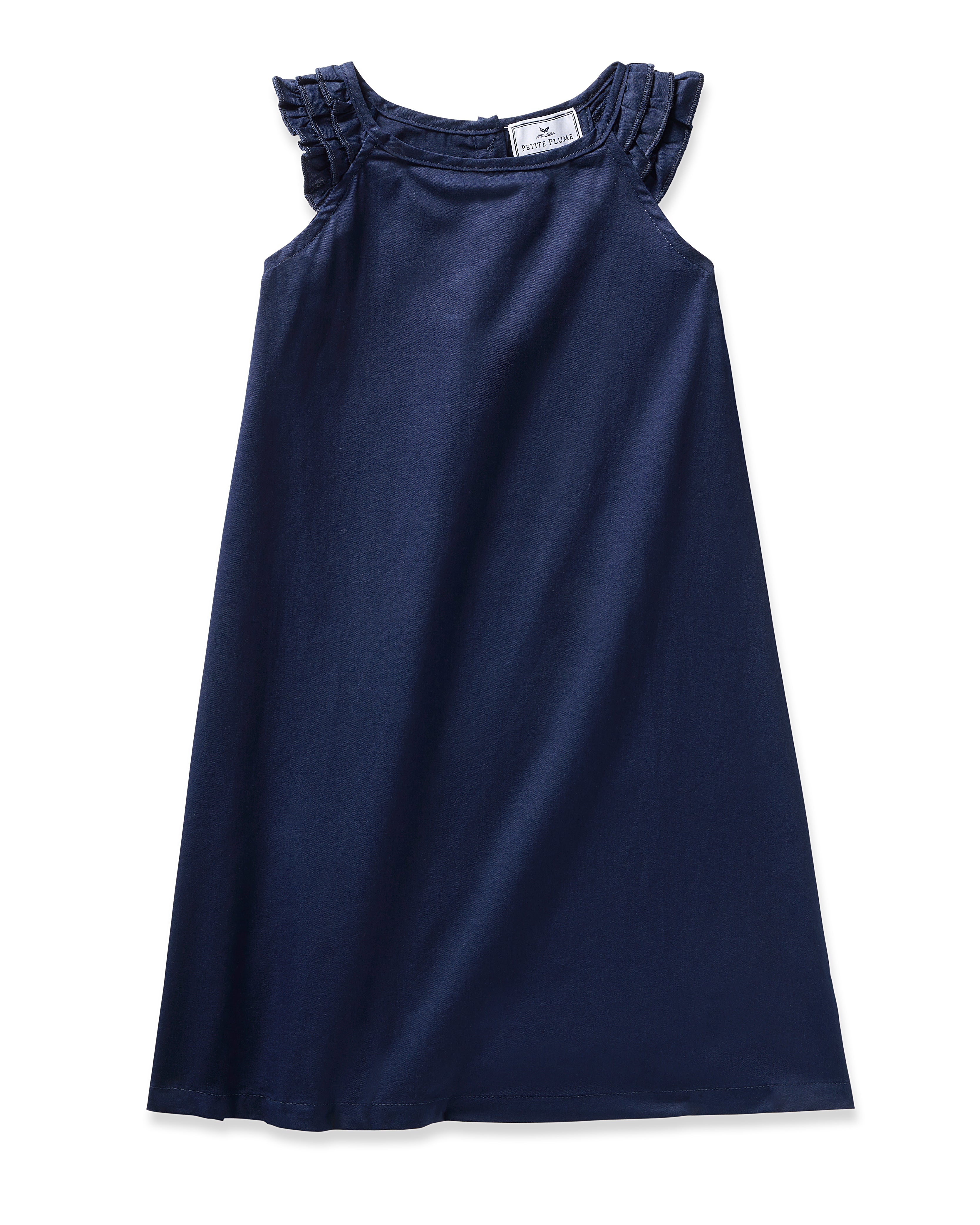 The Girls Twill Amelie Nightgown in Navy by Petite Plume is a sleeveless dress made of premium cotton, featuring ruffled shoulder details and an elegant A-line silhouette.