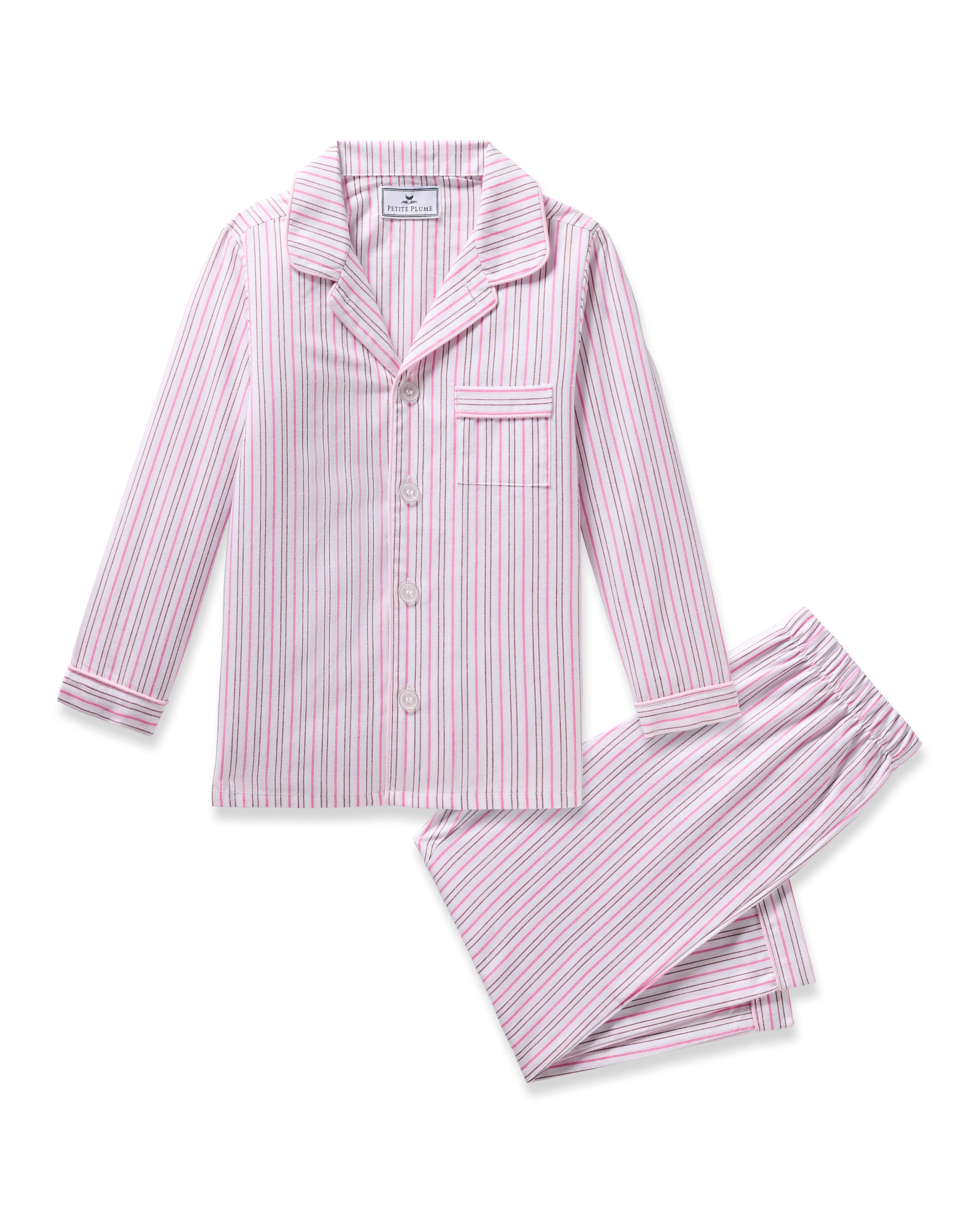 The Kids Twill Pajama in Blush Boulevard by Petite Plume features a charming pink and white vertical stripe pattern. The long-sleeve button-up top with a chest pocket pairs perfectly with the matching pants, crafted from yarn-dyed cotton for added comfort.