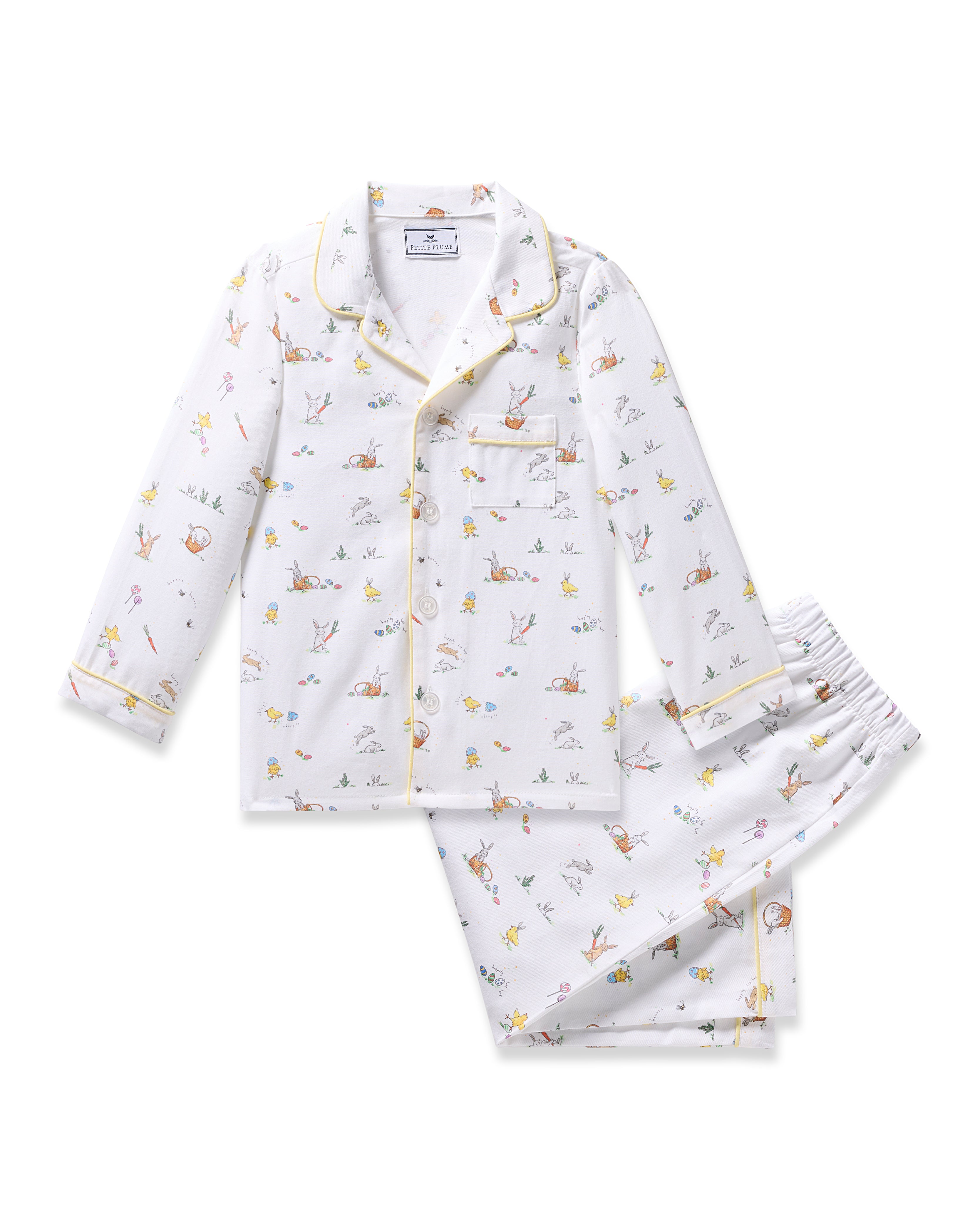 Check out the Kids Twill Pajama in Easter Frolic by Petite Plume. This classic set features colorful woodland prints of rabbits, foxes, and birds on a white background. Its flame-retardant with a long-sleeved button-up top, collar, and matching pants for safety and comfort.
.