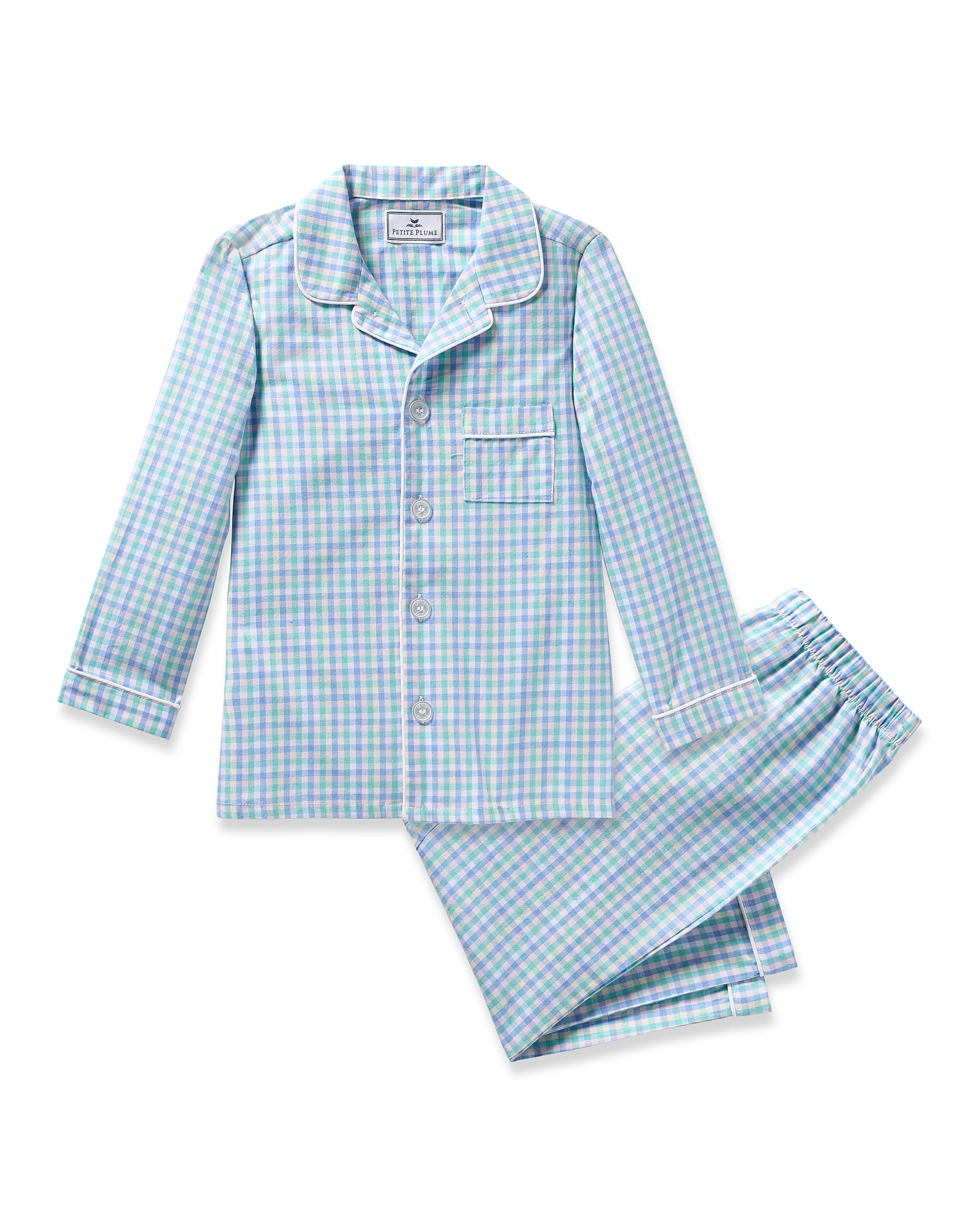 Petite Plumes Kids Twill Pajama in Spring Gingham is a cozy two-piece set made from yarn-dyed cotton featuring a blue, green, and white checkered design. The long-sleeved shirt includes a collar, front buttons, and chest pocket, paired with matching pants for comfort.