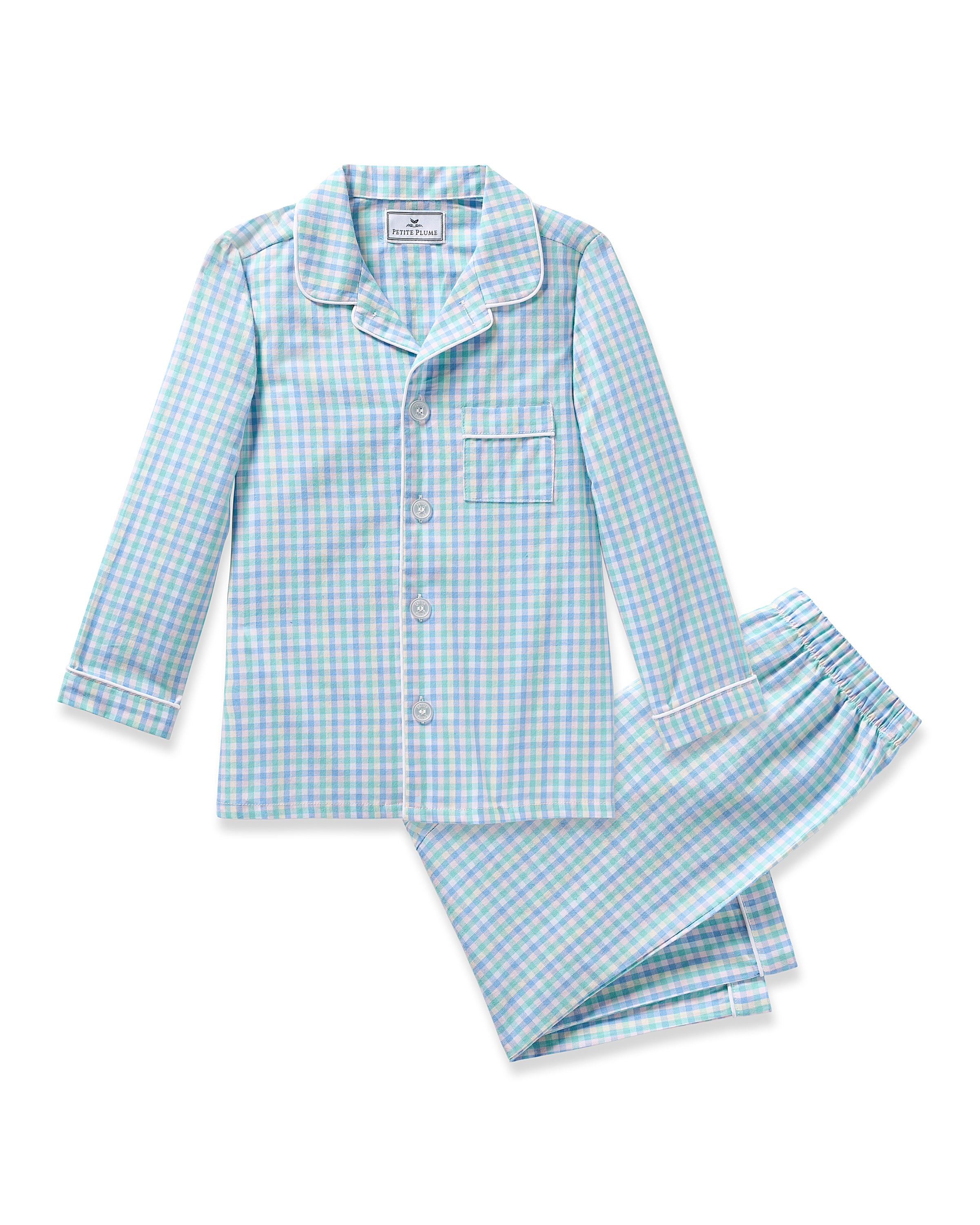 The Kids Twill Pajama in Spring Gingham by Petite Plume showcases a collared button-up top and matching elastic waist pants in light blue and white checkered yarn-dyed cotton, all set against a plain white background.