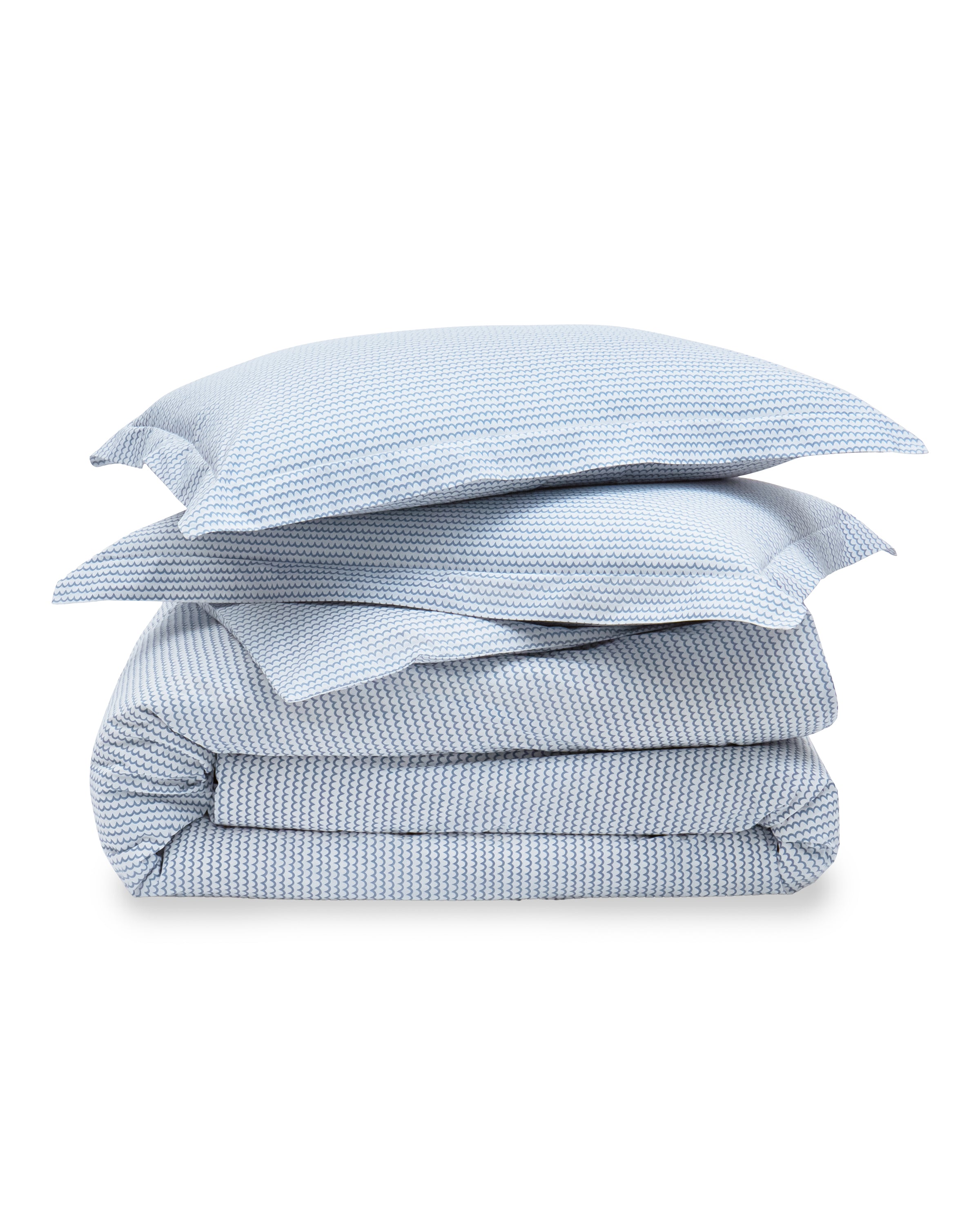 The Luxe Premium Percale Duvet Set in La Mer by Petite Plume includes two pillows and a comforter in soft, fluffy 100% cotton with a light blue and white striped pattern, offering a cozy and luxurious bedding experience.