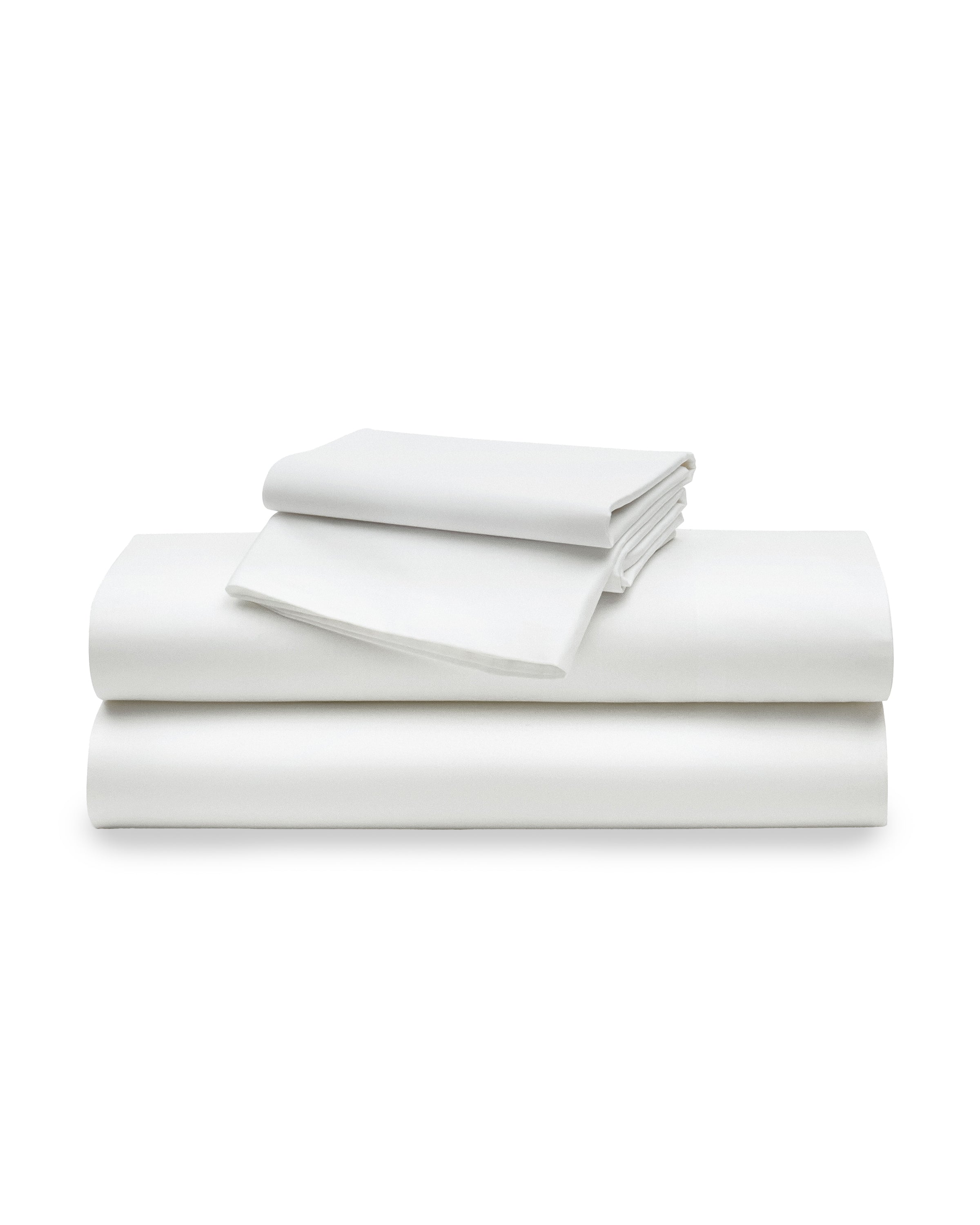 A stack of Signature Luxe Sateen Bed Sheets in White by Petite Plume, crafted from 100% long-staple cotton, includes a flat sheet, a fitted sheet, and two pillowcases, delivering the indulgent comfort of five-star hotel linens.