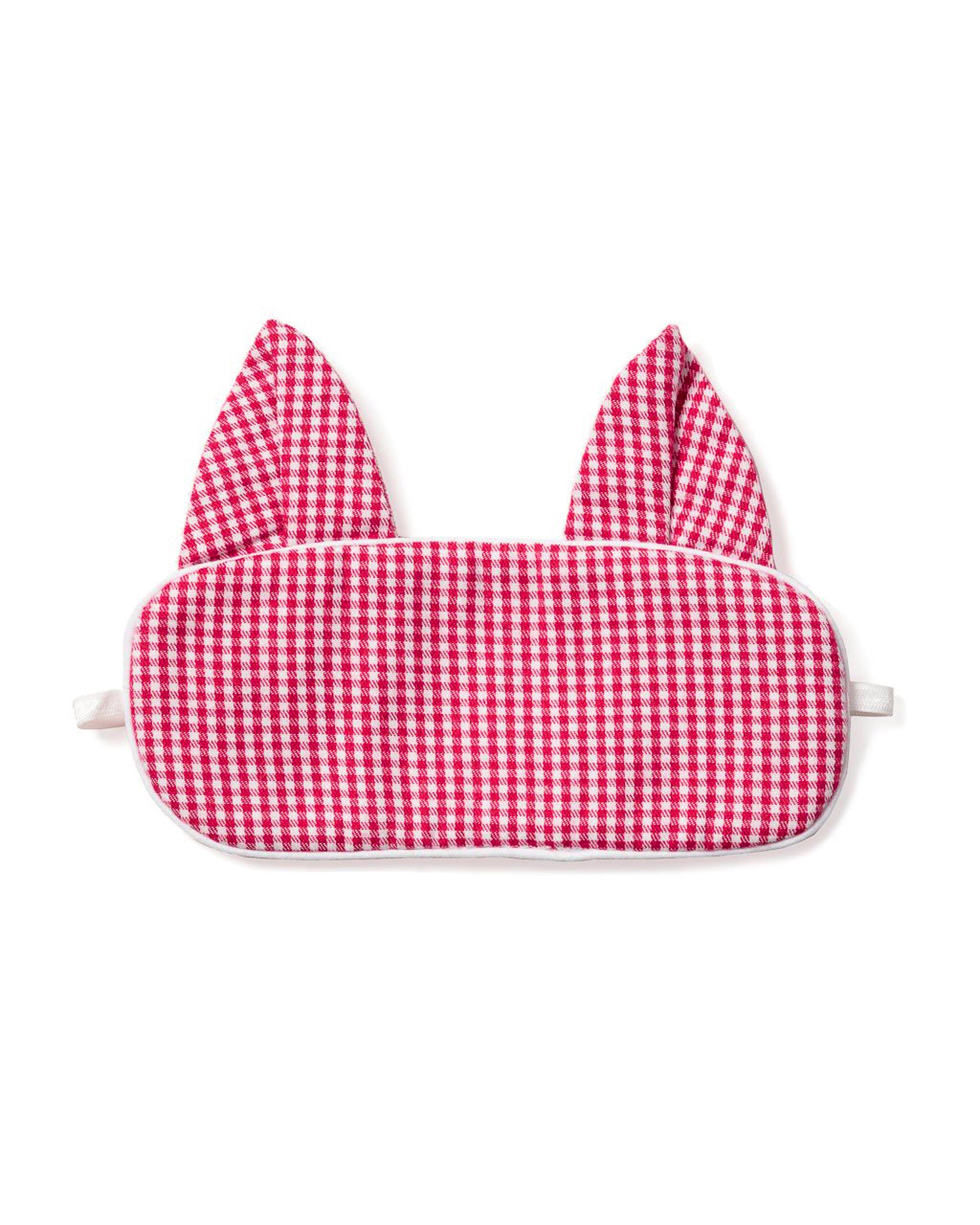 The Petite Plume Kids Flannel Red Mini-Gingham Kitty Sleep Mask features a red and white checkered design with ear-like extensions, white trim, and elastic straps, making it a perfect monogrammed gift for those who cherish luxury and comfort.