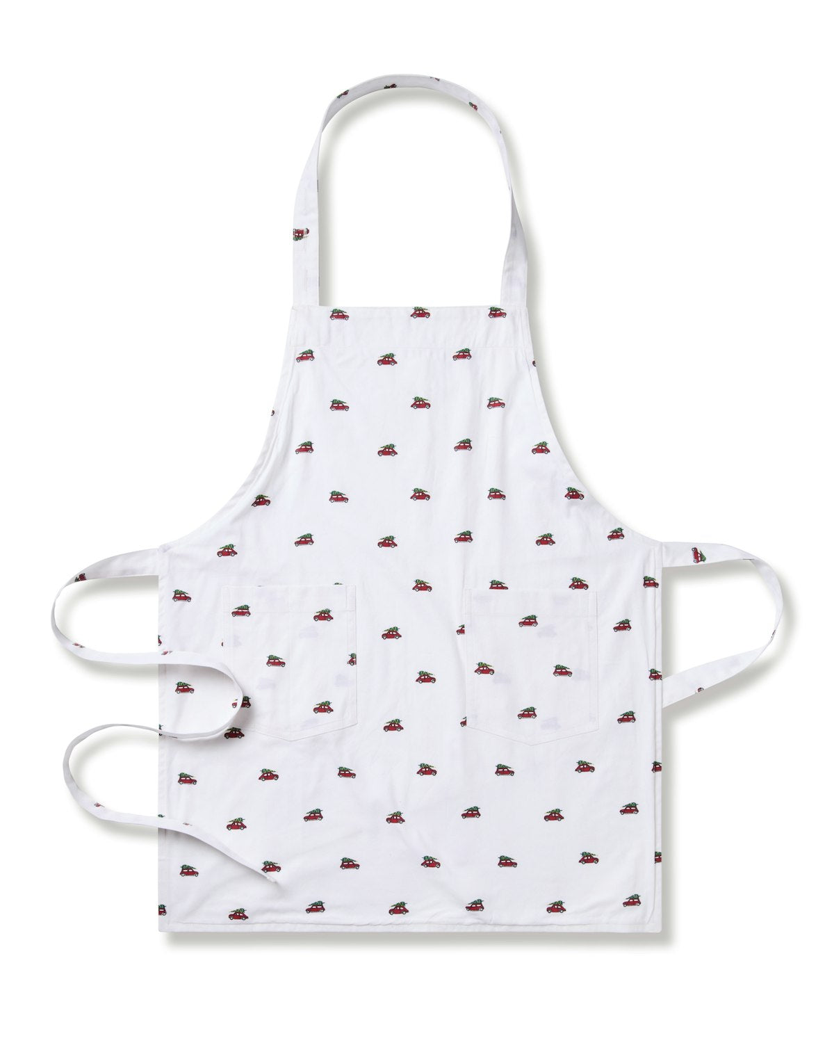 The Kids Apron in Holiday Journey by Petite Plume is perfect for holiday baking, featuring small sneaker prints on white. In childrens sizes, it offers neck and waist ties and two front pockets. Displayed flat against a white backdrop.