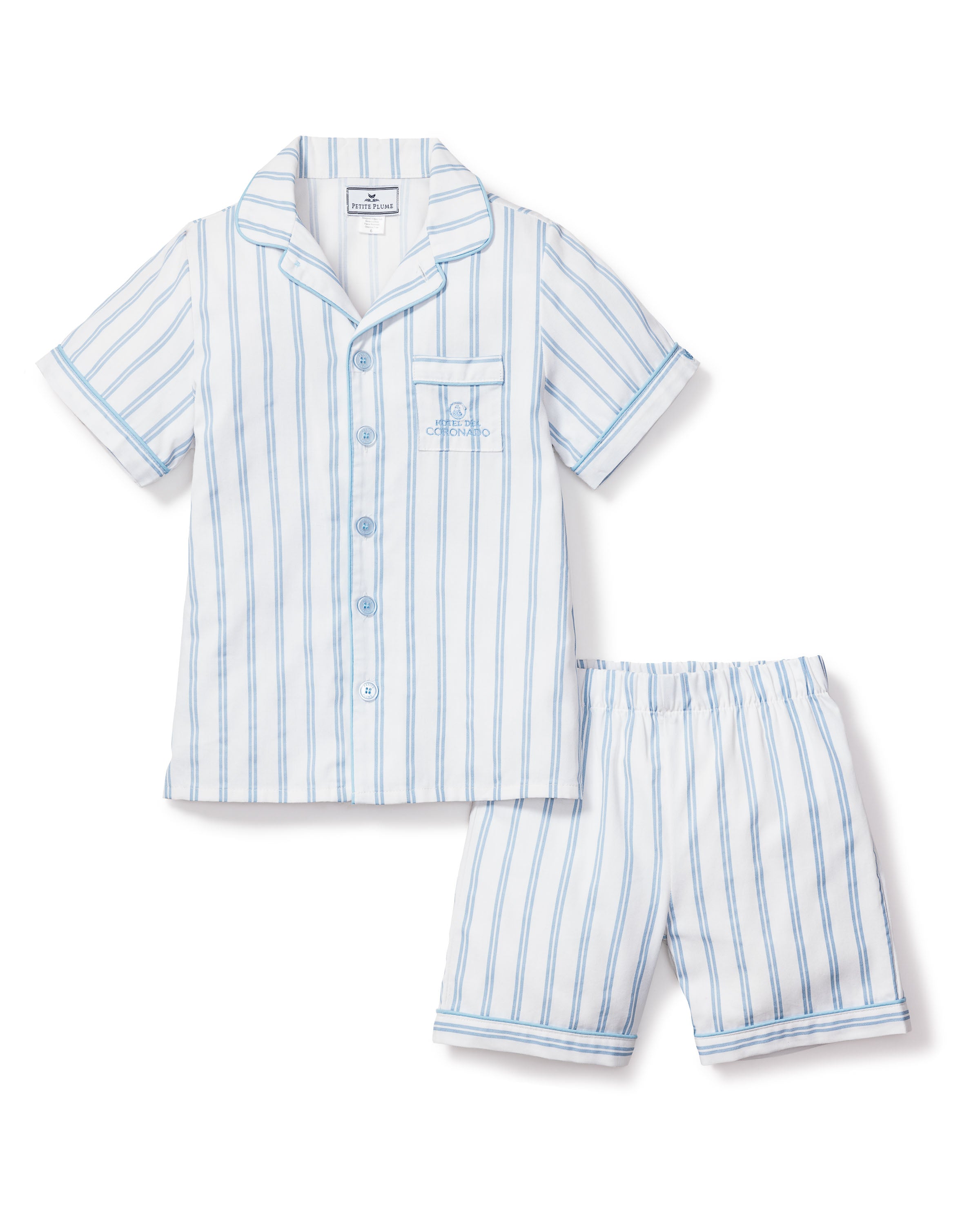 The Kids Twill Periwinkle Stripe Short Set by Petite Plume x Hotel del Coronado features light blue vertical stripes on white and includes a collared, buttoned top with embroidered logo and elastic-waist shorts.