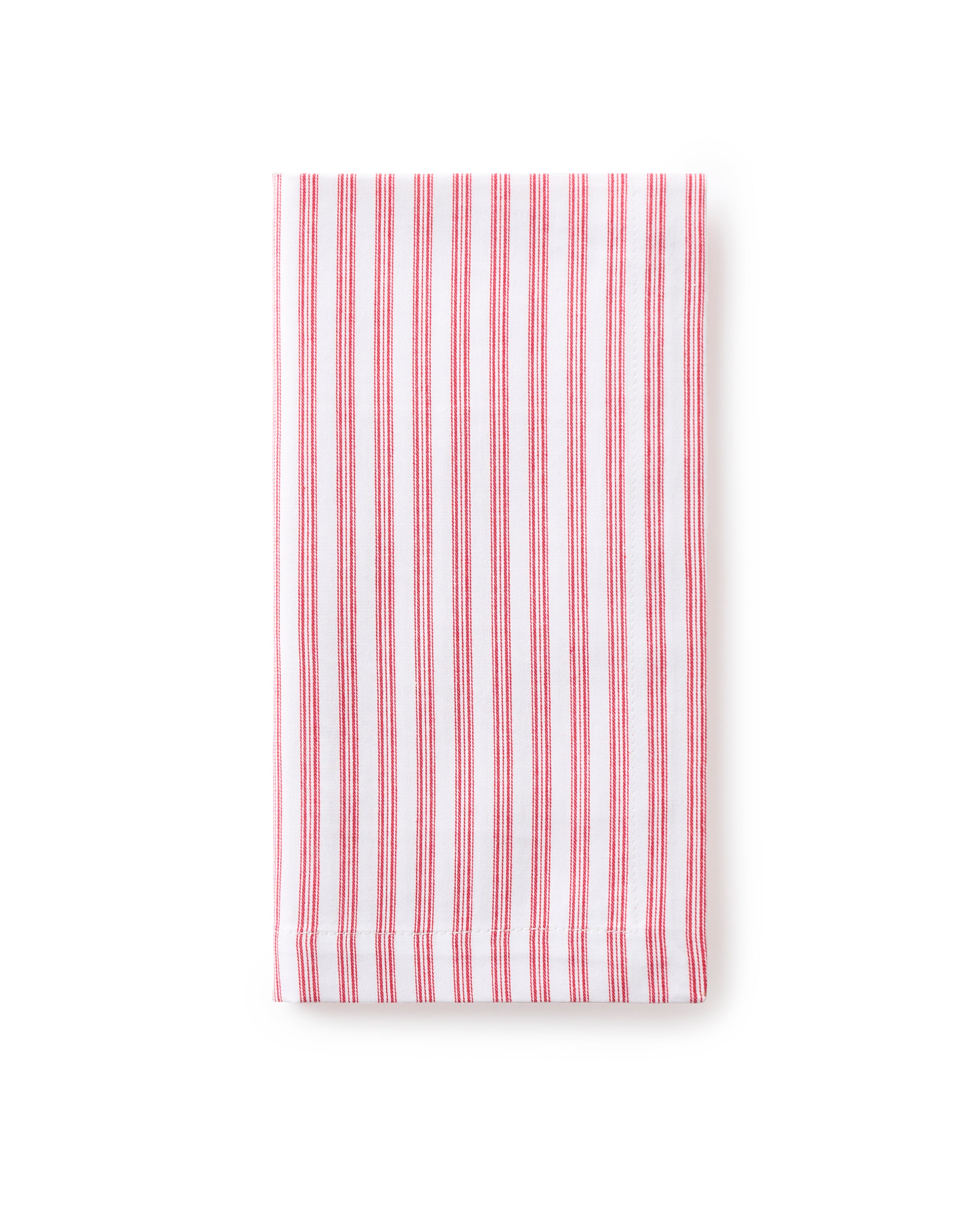 A Signature Twill Table Napkin in Antique Red Ticking by Petite Plume, reminiscent of classic cotton table linens, is neatly folded against a plain white background.