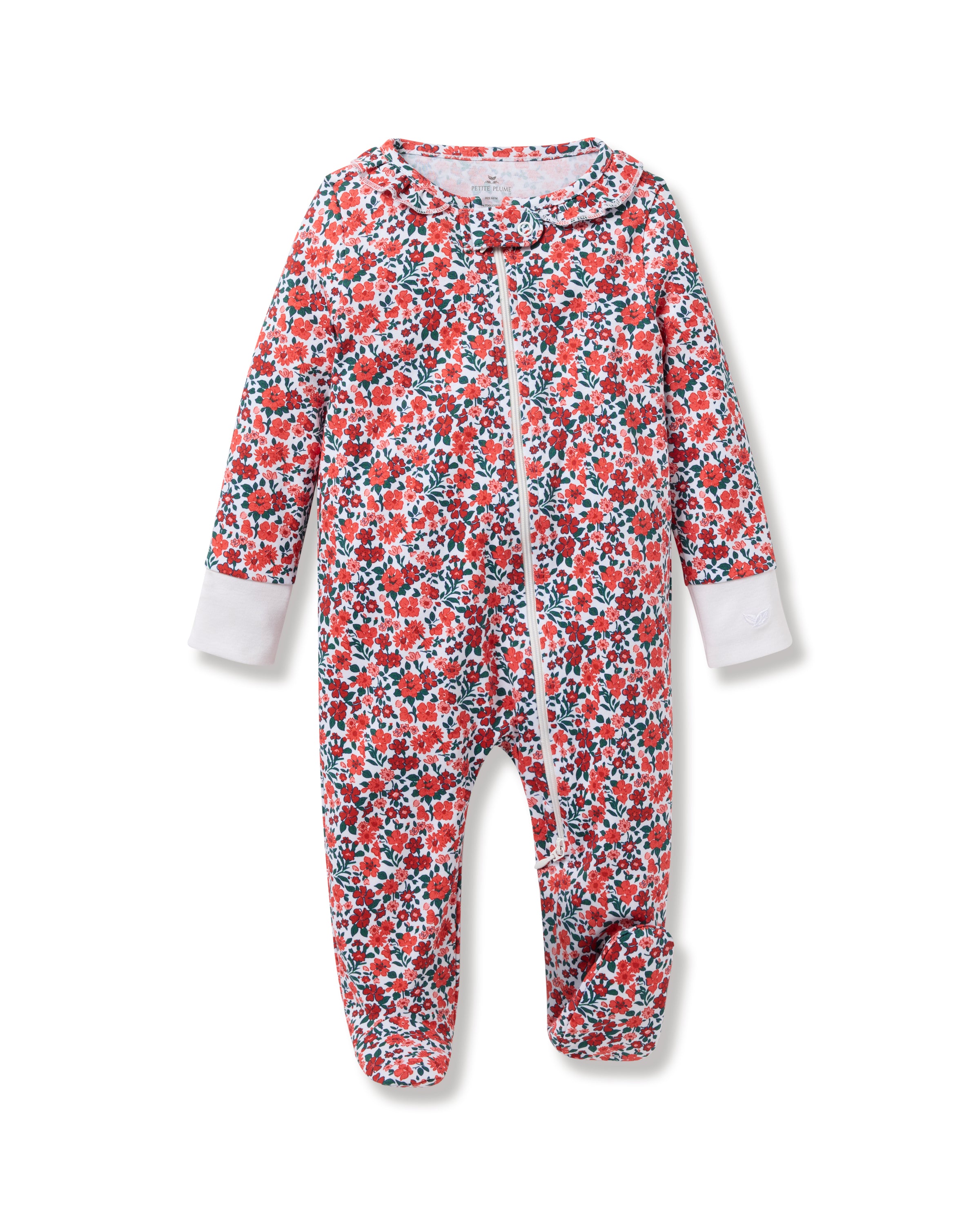 The Babys Pima Ruffle Collar Romper in Fleurs des Bois by Petite Plume is a soft Pima cotton onesie with a floral pattern of red and green flowers, white cuffs, and a diagonal zipper from neck to foot, ideal for cozy sleepwear.