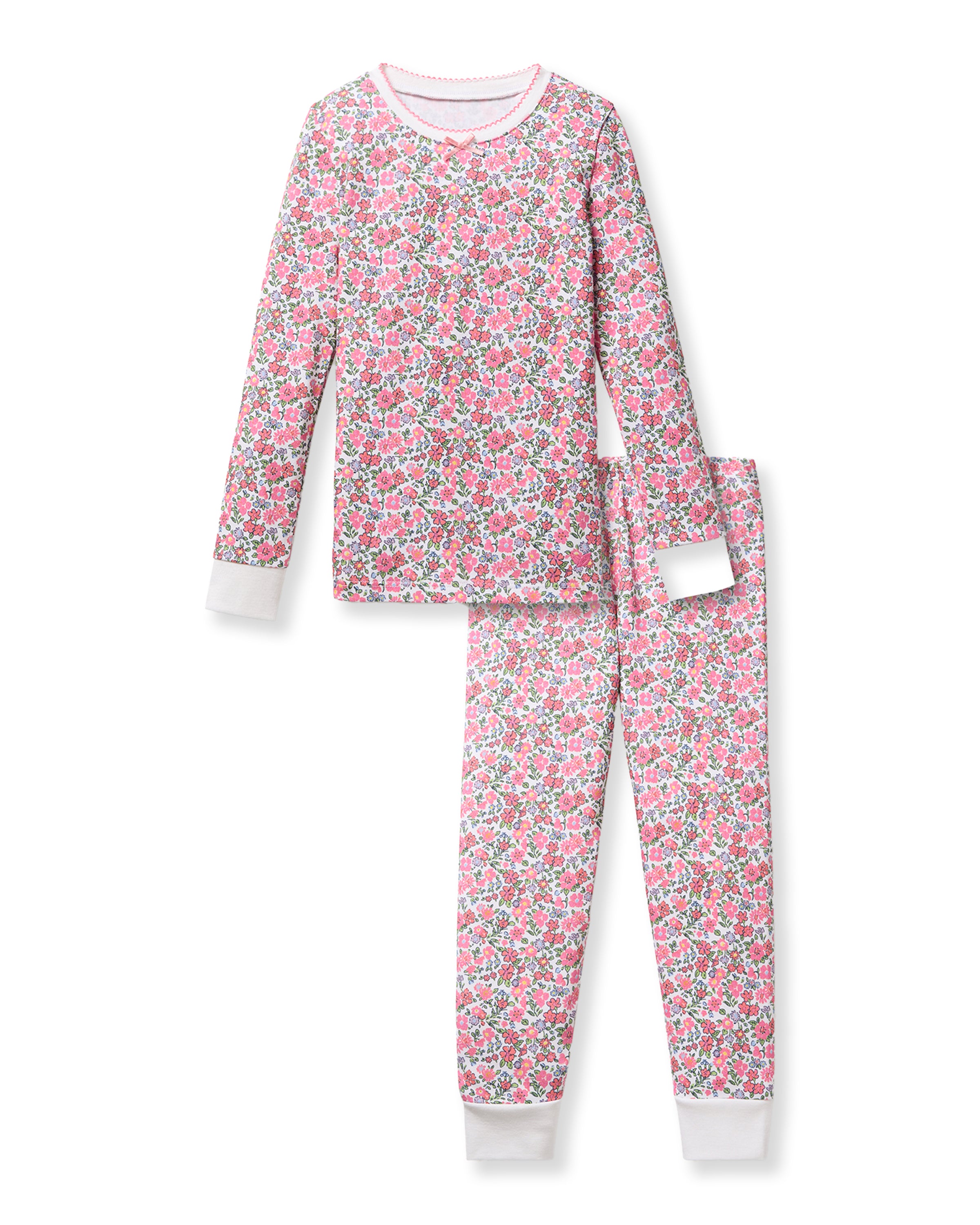 The Kids Pima Snug Fit Pajama Set in Fleurs de Rose by Petite Plume features a long-sleeve top and matching pants with pink, green, and white floral patterns on a light background, complemented by crisp white cuffs and neckline. Crafted from soft Pima Cotton for comfort.