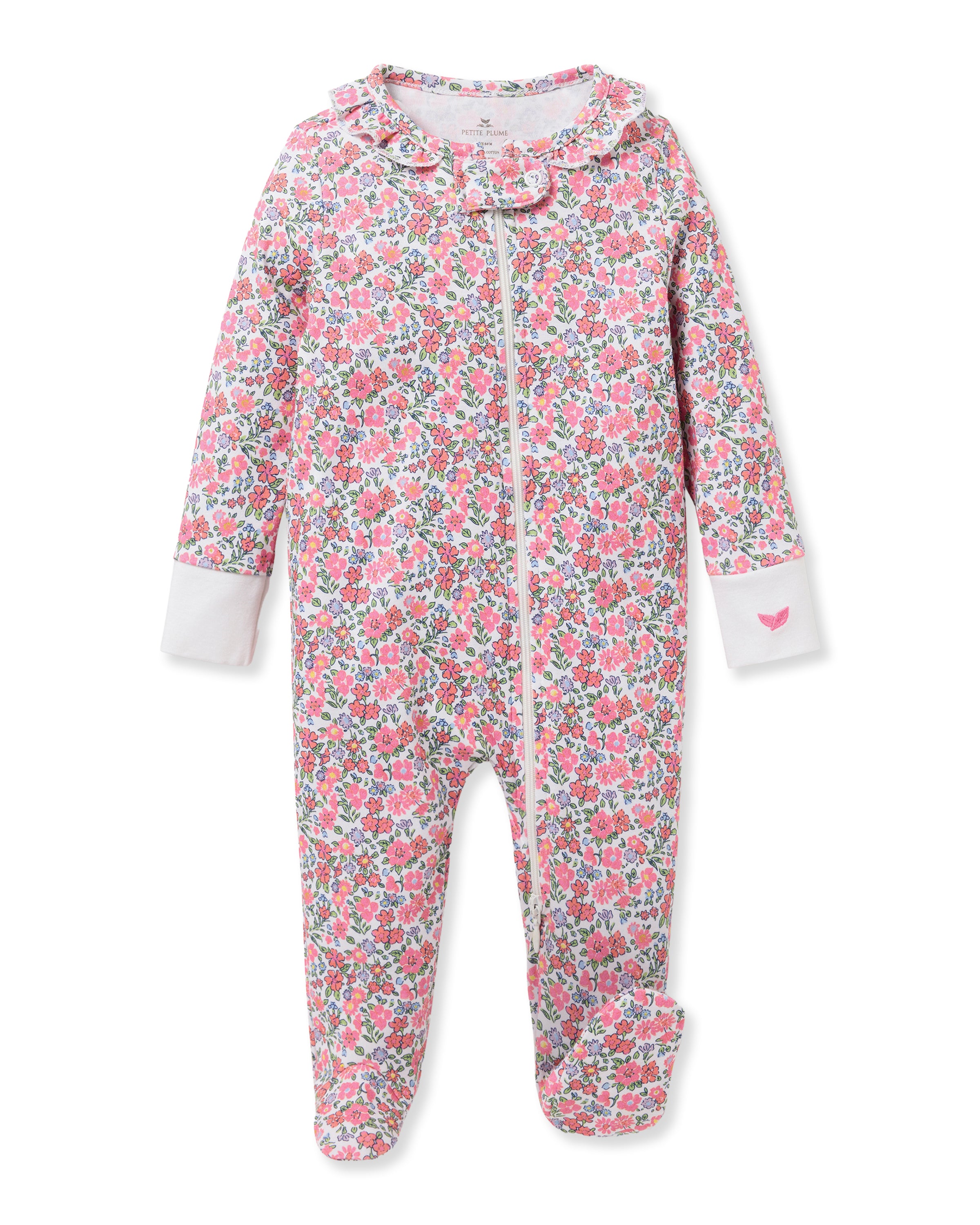 Petite Plumes Babys Pima Ruffle Collar Romper in Fleurs de Rose, made of 100% Pima cotton, features a pink, white, and green floral pattern. It offers long sleeves, covered feet for comfort, a practical front zipper, and an adorable pink heart detail.