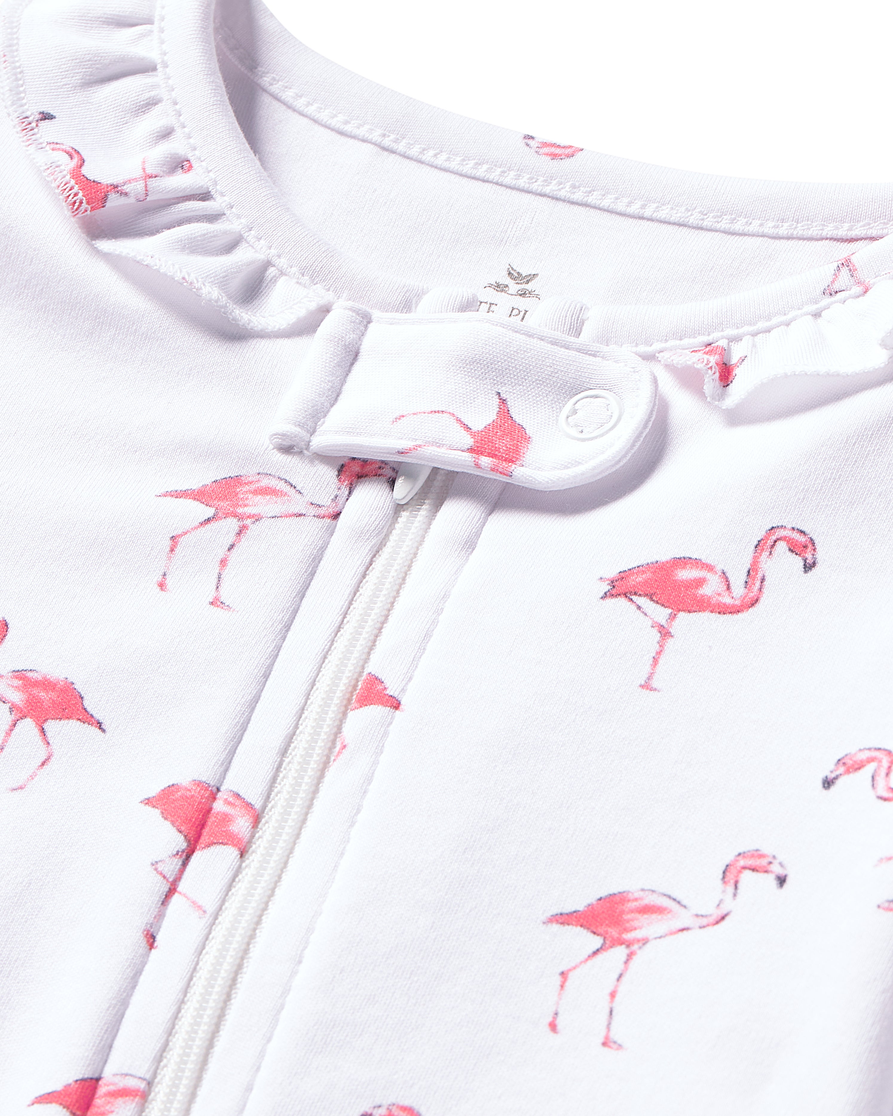 Petite Plumes Babys Pima Ruffle Collar Romper in Flamingo showcases a charming pink flamingo print on soft white fabric. This playful onesie, crafted from cozy Pima cotton, features vibrant colors along with a zipper, snap button closure, and ruffled collar for extra cuteness and comfort.