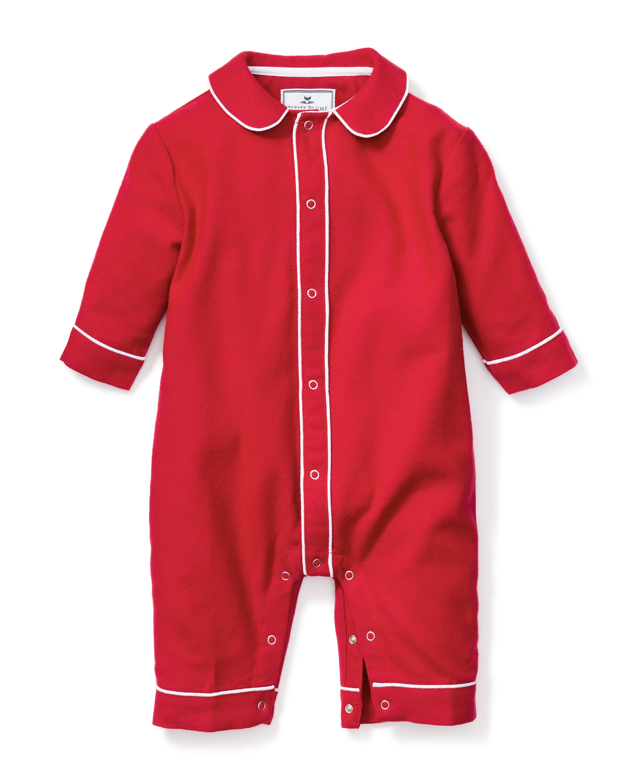 The Babys Flannel Cambridge Romper in Red by Petite Plume features long sleeves, white trim, a collar, and button-down front. Made from flame-retardant fabric with additional bottom buttons for easy changing, this soft material ensures comfort in childrens sleepwear.