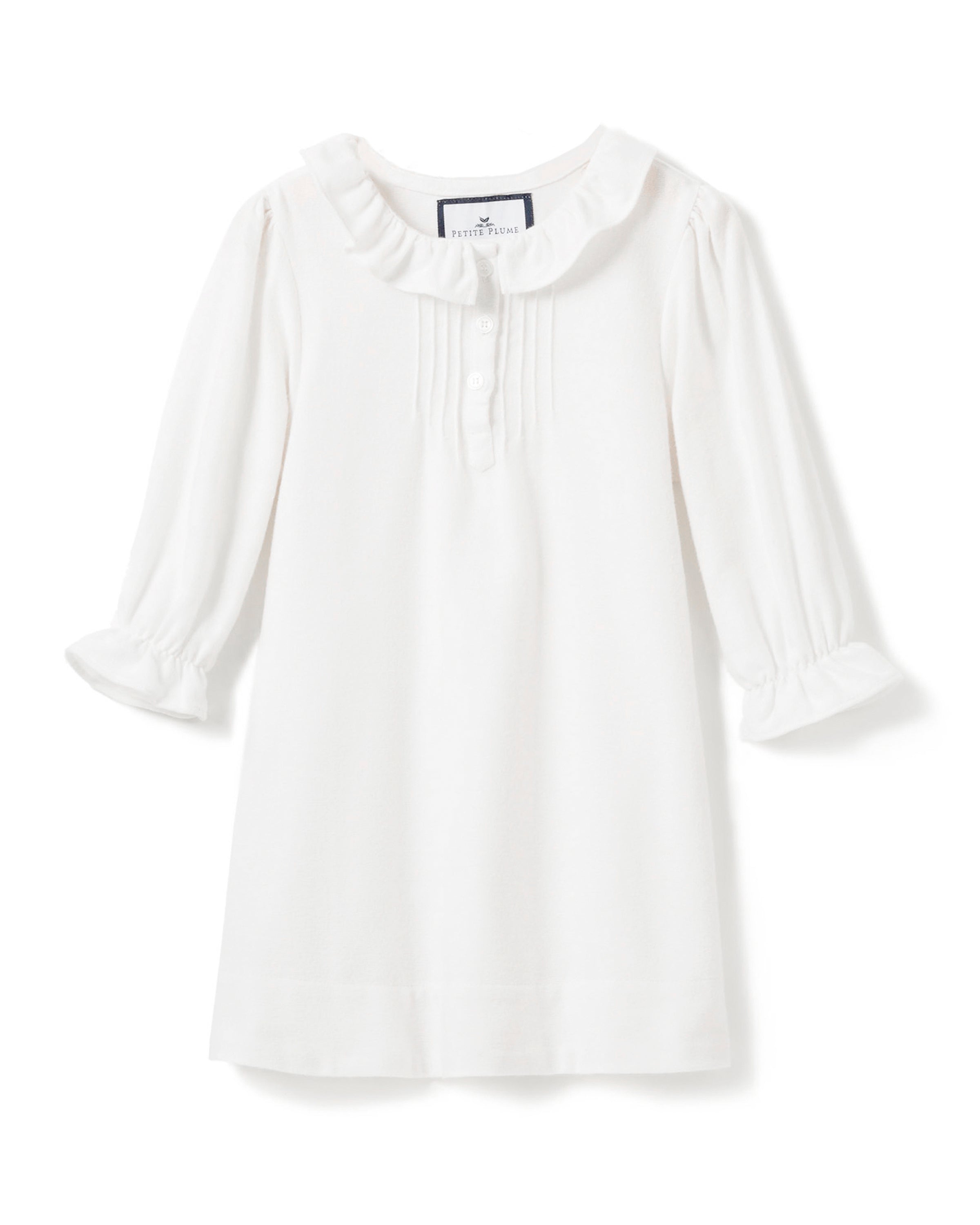 The Girls Flannel Victoria Nightgown in White by Petite Plume features a yarn-dyed cotton design with a ruffled collar, pleated details near the four-button placket, and elasticated ruffled cuffs for added charm.