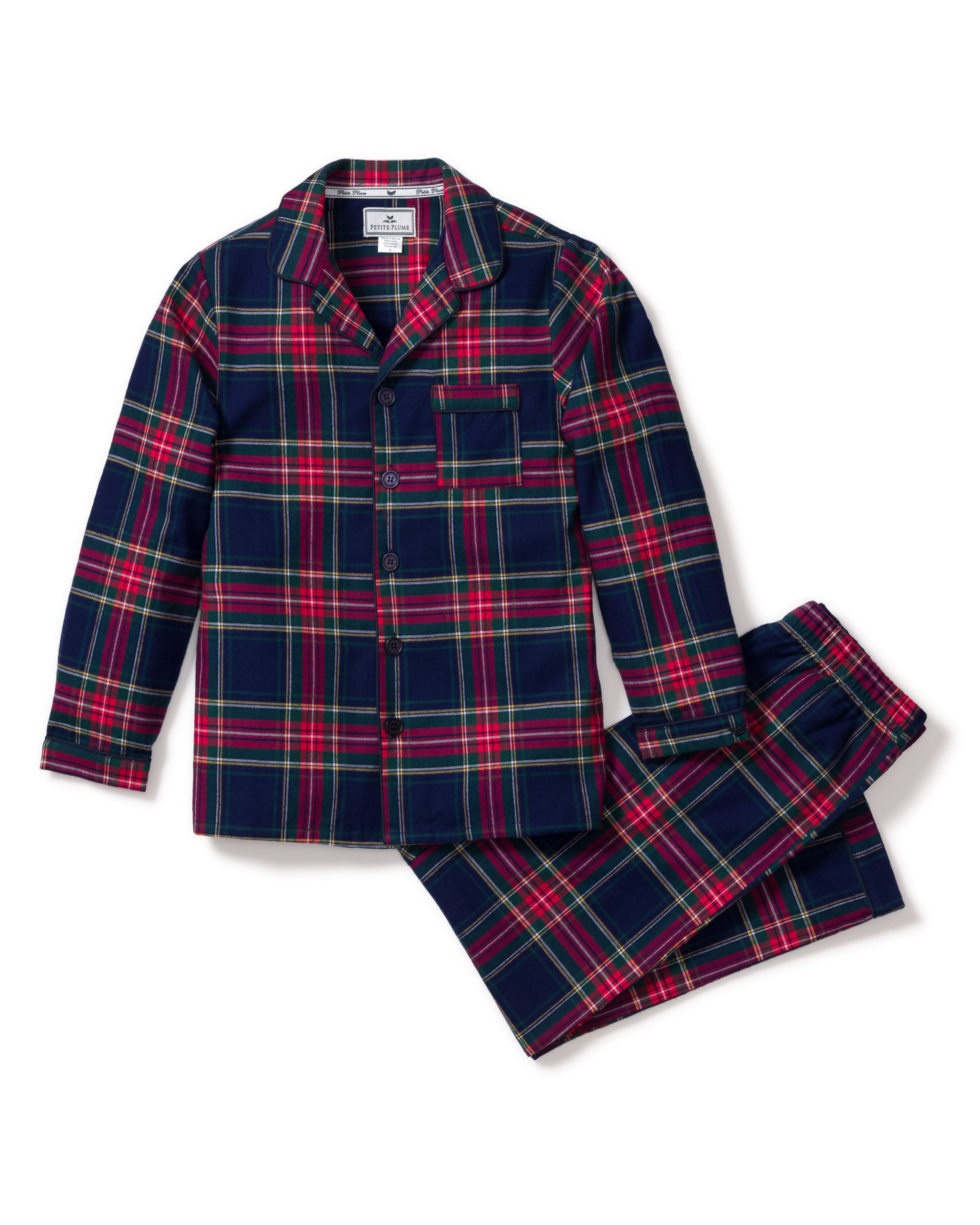 Petite Plumes Kids Brushed Cotton Pajama Set in Windsor Tartan includes a two-piece plaid design with a long-sleeve button-up top, chest pocket, and matching pants, all featuring a luxurious red, green, and navy tartan pattern.