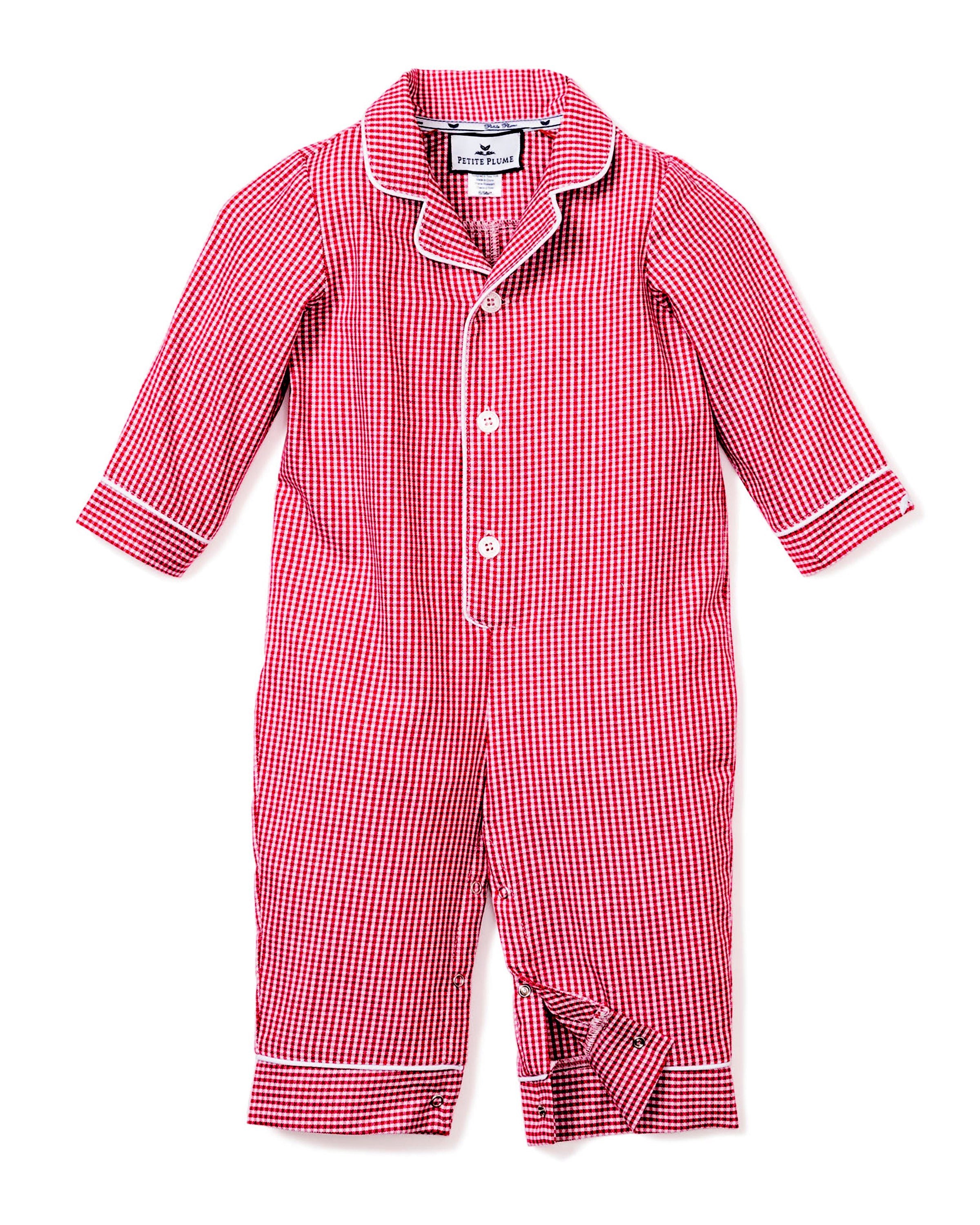 The Petite Plume Babys Flannel Romper in Red Mini Gingham features long sleeves, white trim, a button-up front, and a small collar, making it perfect for cozy sleepwear.