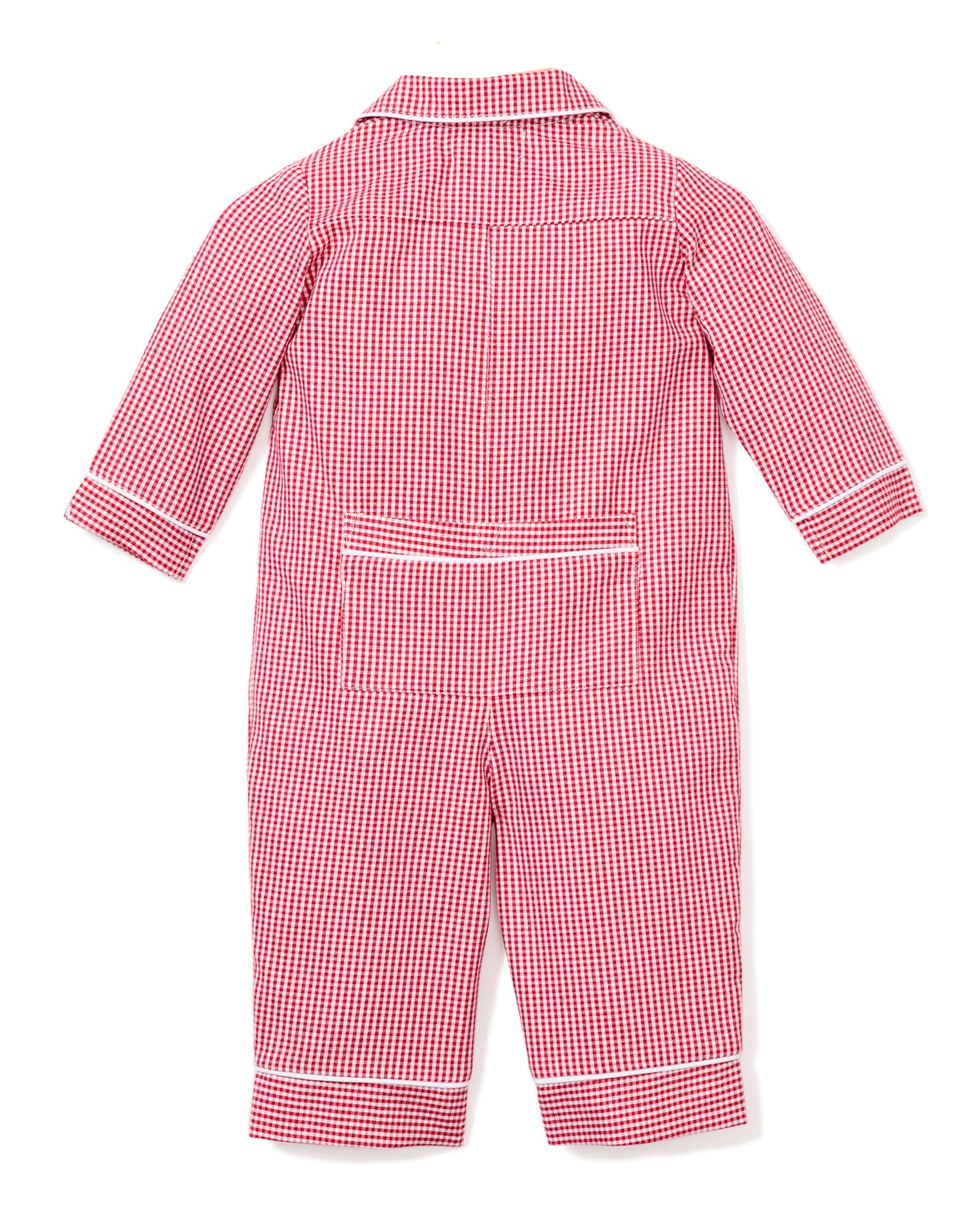 Petite Plumes Babys Flannel Romper in Red Mini Gingham has long sleeves, white piping on cuffs, collar, and waistband. Displayed flat, it shows the back side with a lower back pocket.