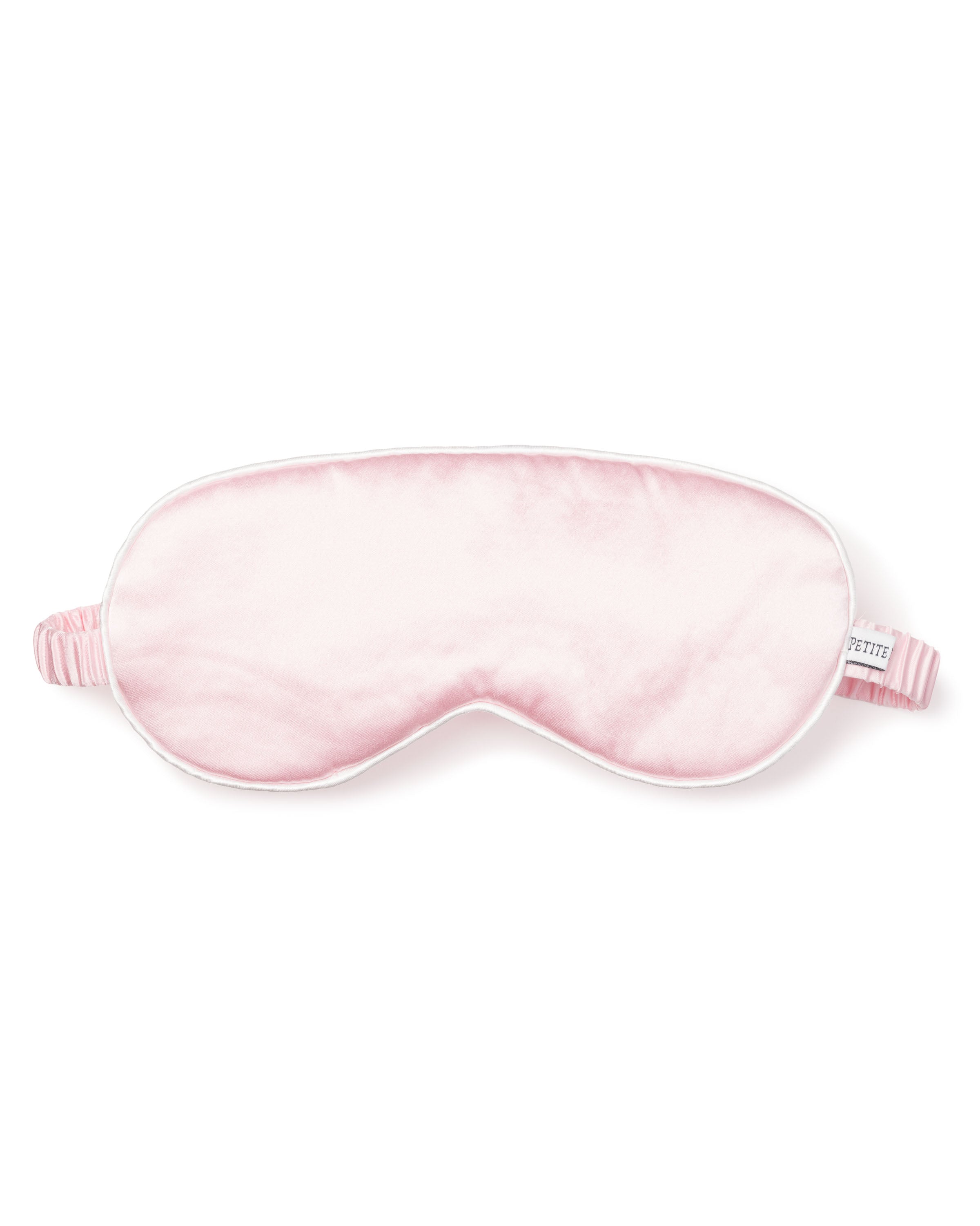 The Womens Silk Sleep Mask in Pink by Petite Plume features a soft, cushioned texture and a striped elastic strap, crafted from pure silk for ultimate comfort.