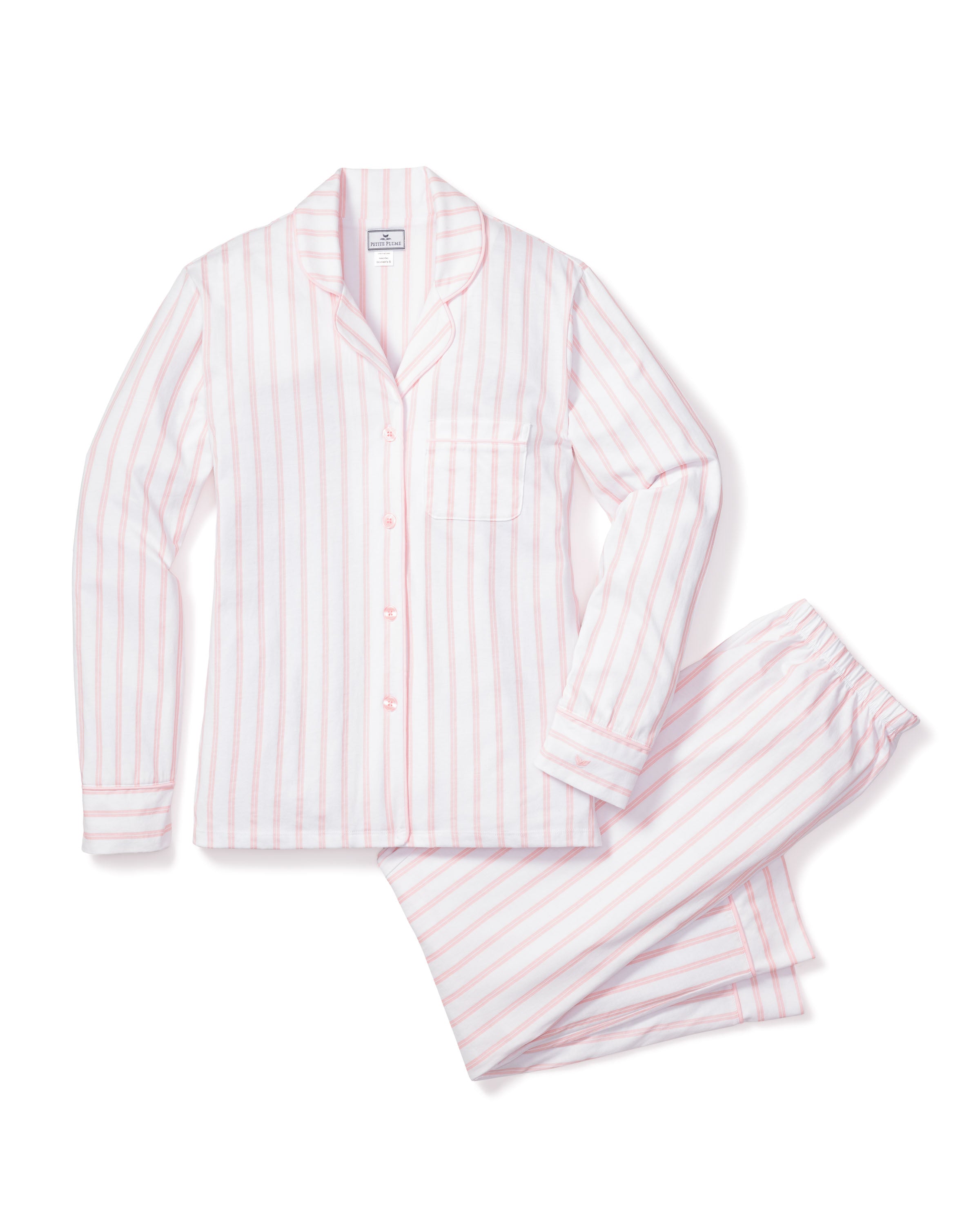 The Womens Pima Pajama Set in Pink Stripe by Petite Plume features a luxurious white Pima cotton design with pink vertical stripes. It includes a long-sleeve button-up shirt with chest pocket and matching pants with an elastic waistband, all showcased on a white background.