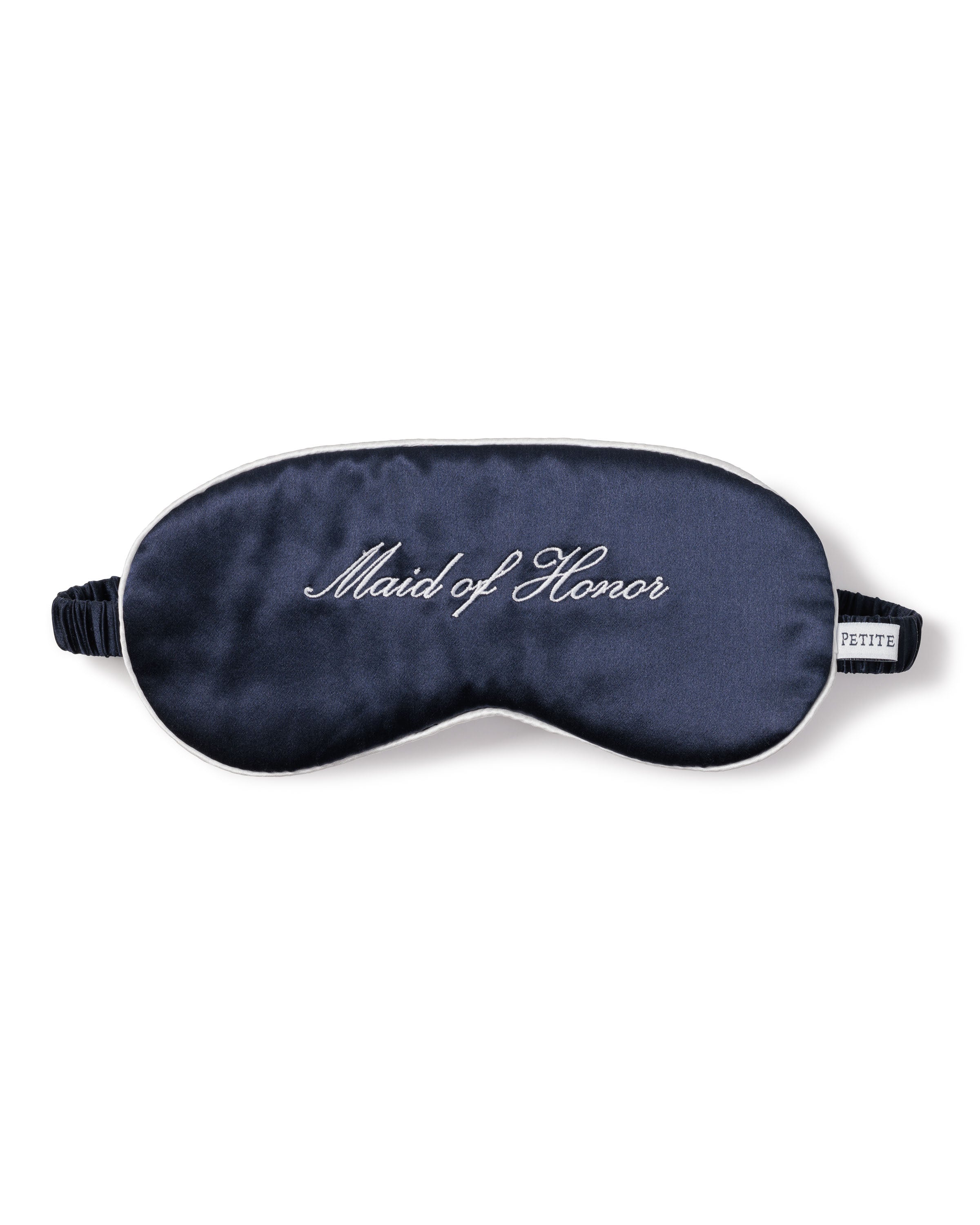 The Womens Silk Maid of Honor Sleep Mask by Petite Plume is a luxurious dark blue silk accessory with Maid of Honor embroidered in cursive. Designed for comfort, it features an adjustable elastic band and a petite tag—perfect as a thoughtful gift for restful sleep.