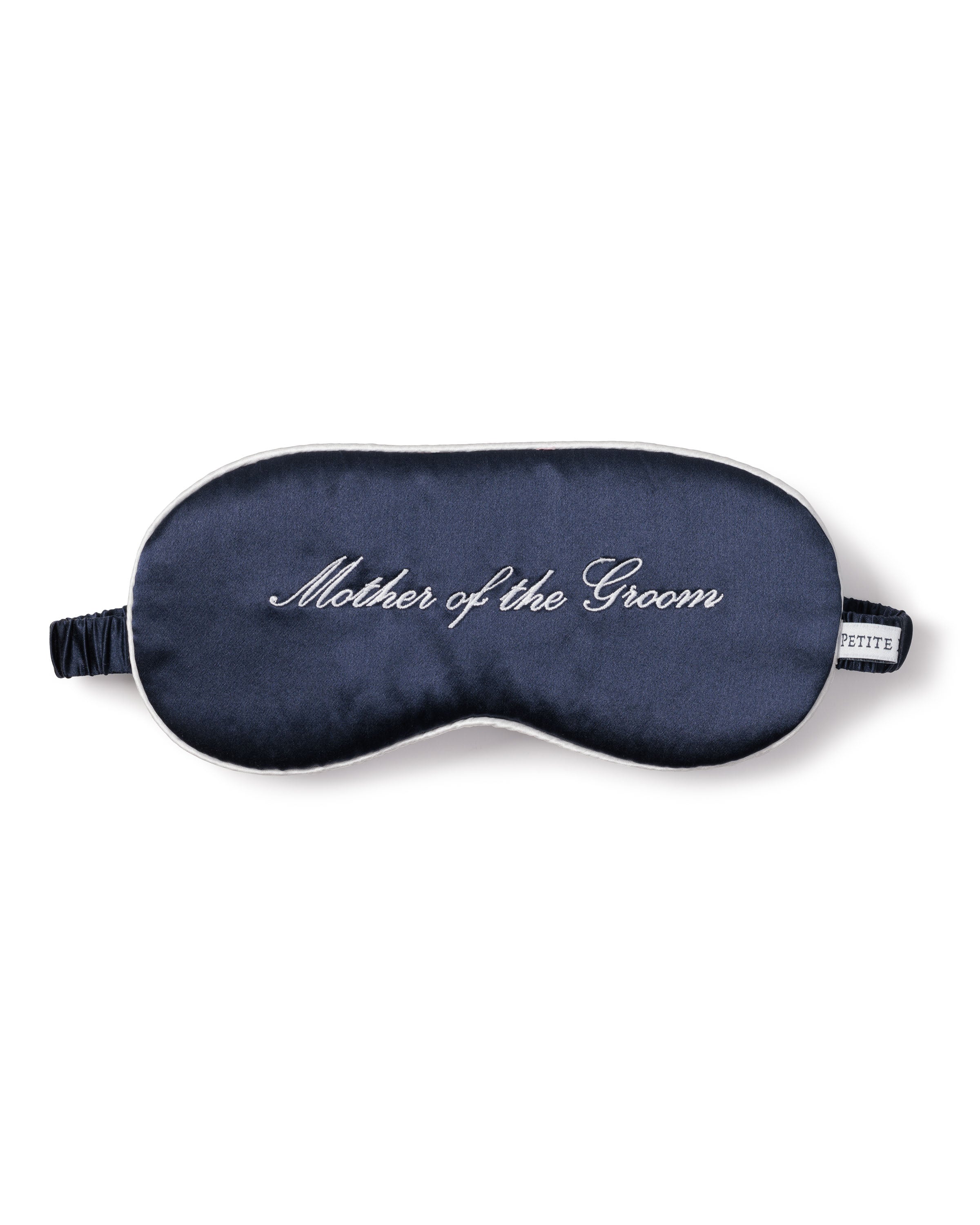 The Petite Plume Womens Silk Mother of the Groom Sleep Mask, in luxurious navy blue silk with Mother of the Groom elegantly embroidered in white, features an elastic strap for a snug fit—perfect as a gift for restful moments before the wedding.