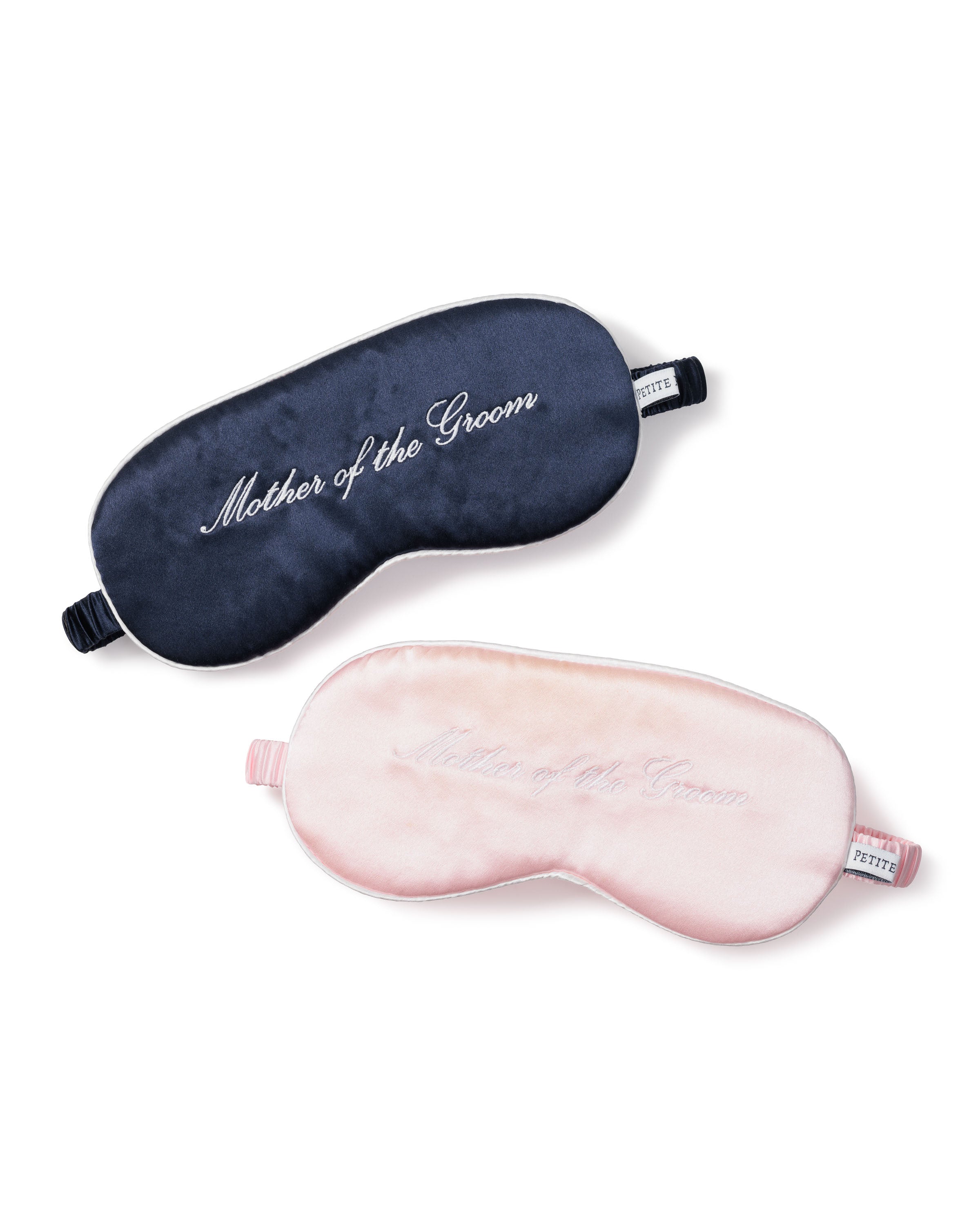 Two Petite Plume 22mm pure silk sleep masks, one navy and one light pink, each feature Mother of the Groom in elegant script, making them an ideal Mother of the Groom gift for relaxation on the wedding day.