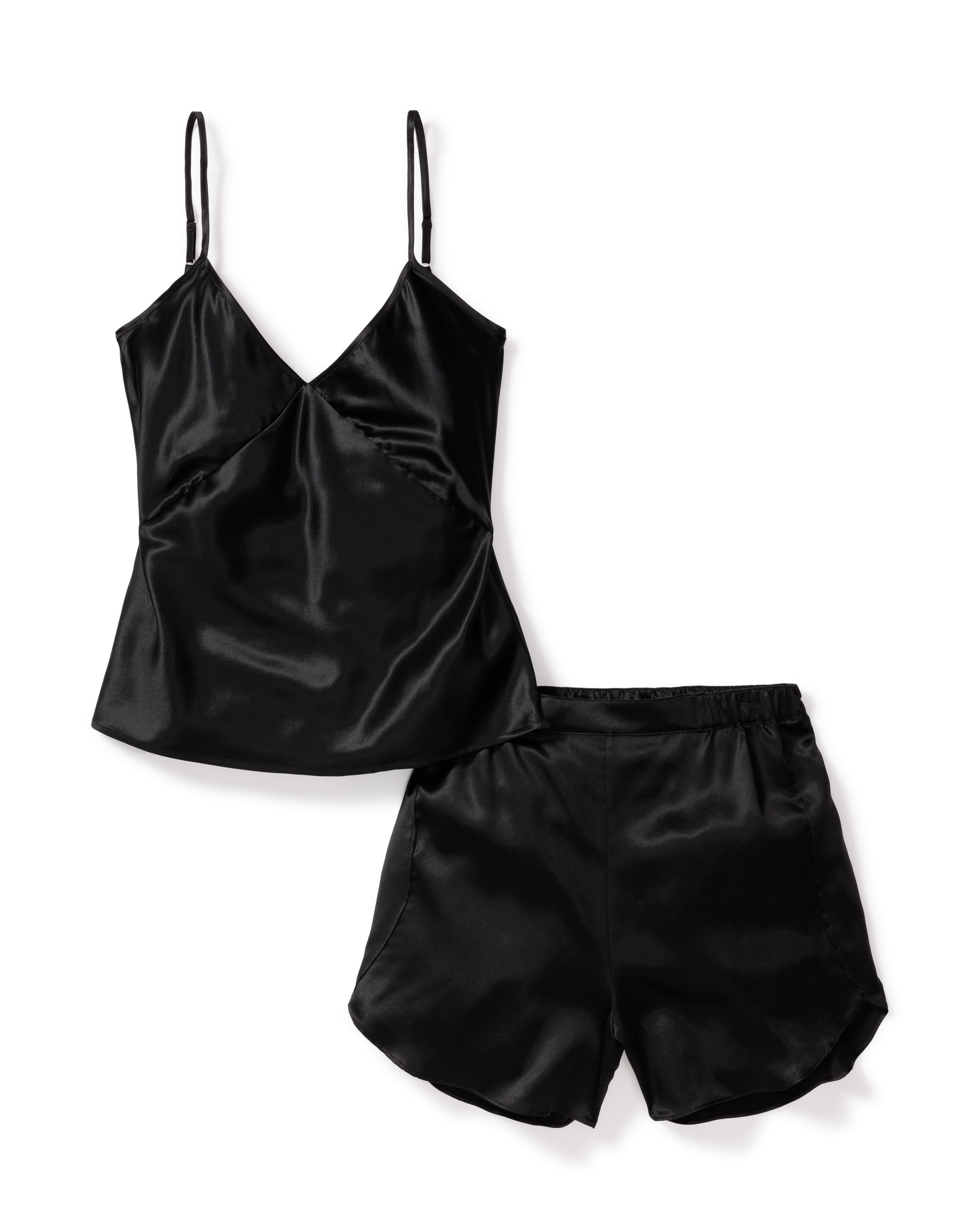 Indulge in luxury with Petite Plumes Womens Silk Cami Short Set in Black, crafted from hypoallergenic mulberry silk. This set features a camisole with thin straps and a V-neckline, paired with matching shorts, all enhanced by a shiny finish for an elegant touch to your comfort.