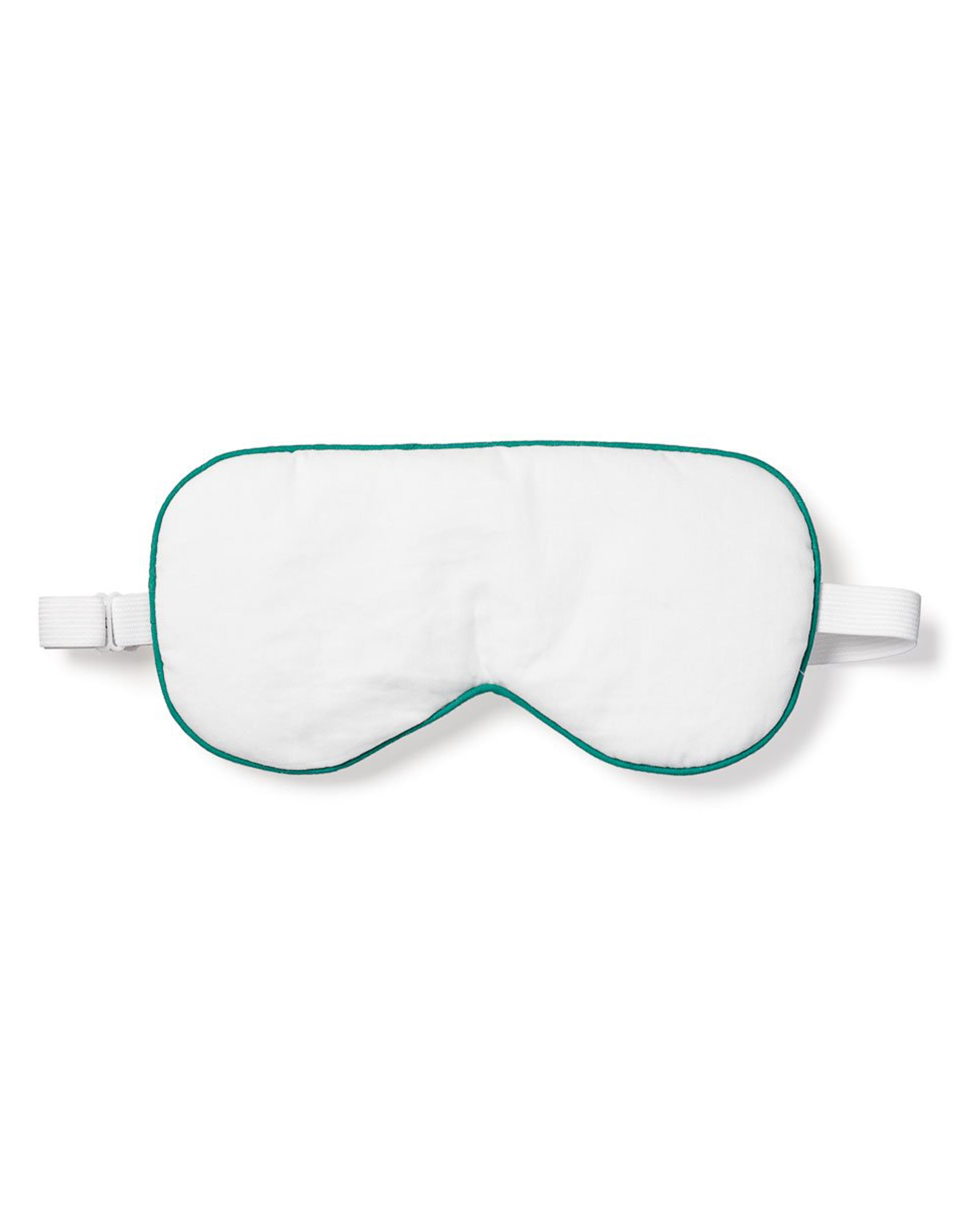 The Petite Plume Adults Sleep Mask in White with Green Piping offers a luxurious sleep experience. Featuring a matching elastic strap, its ideal for blocking light and aiding restful sleep, making it a perfect monogrammed gift for those who cherish nighttime luxury.