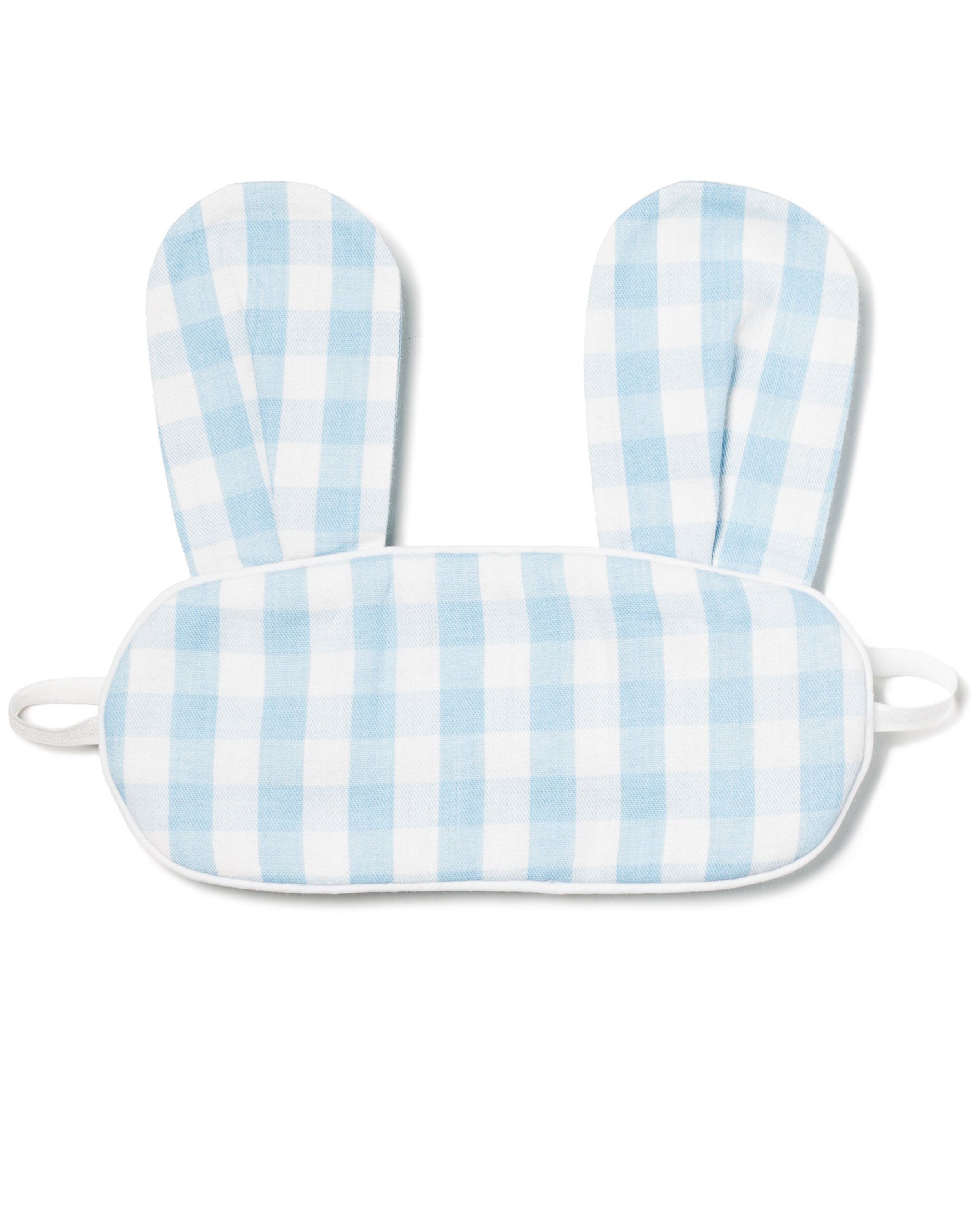 The Kids Twill Bunny Sleep Mask by Petite Plume features a charming light blue gingham design with bunny ears. Its white elastic straps provide comfort, making it perfect for memorable occasions and an ideal monogrammed gift.