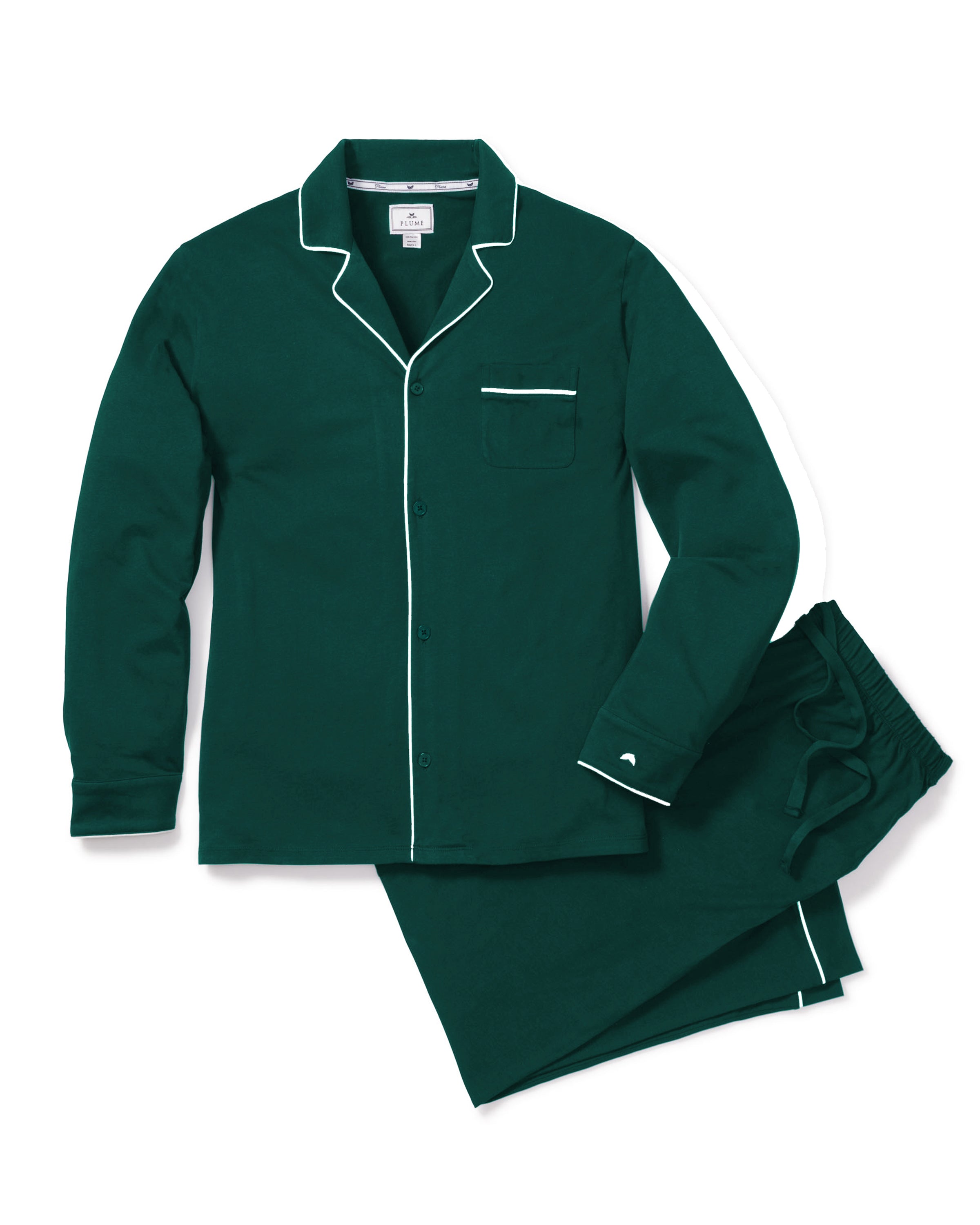 The Mens Pima Pajama Set in Evergreen by Petite Plume is crafted from luxury Peruvian Pima cotton. This timeless set includes a dark green long-sleeve button-up top with white piping and a chest pocket, paired with matching pants featuring an elastic waistband, on a pristine white background.