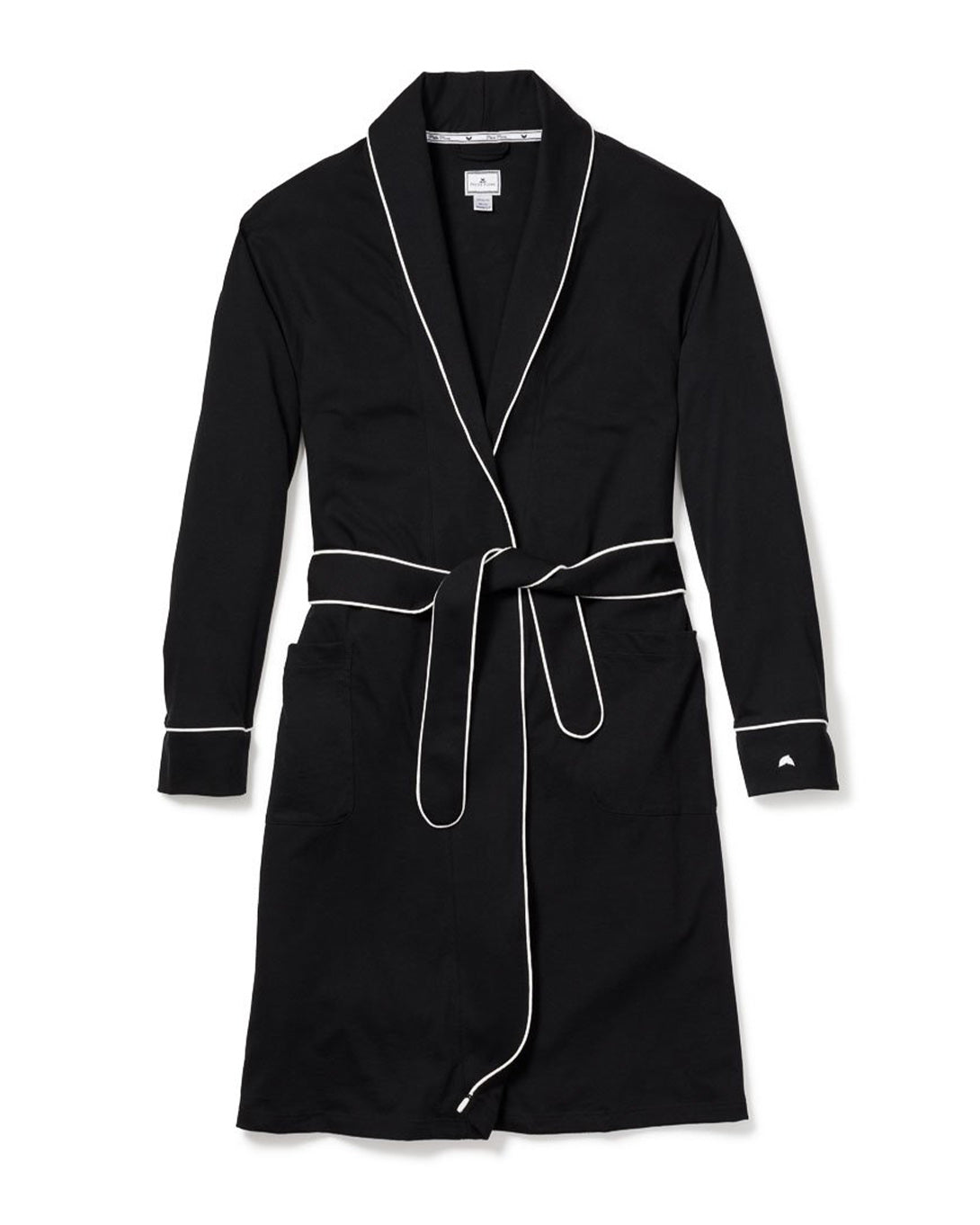 The Womens Pima Robe in Black by Petite Plume features a luxury design crafted from soft Peruvian Pima cotton with white piping, a shawl collar, belted waist, two front pockets, and cuffed sleeves. Displayed on a white background as part of the Pima Collection.