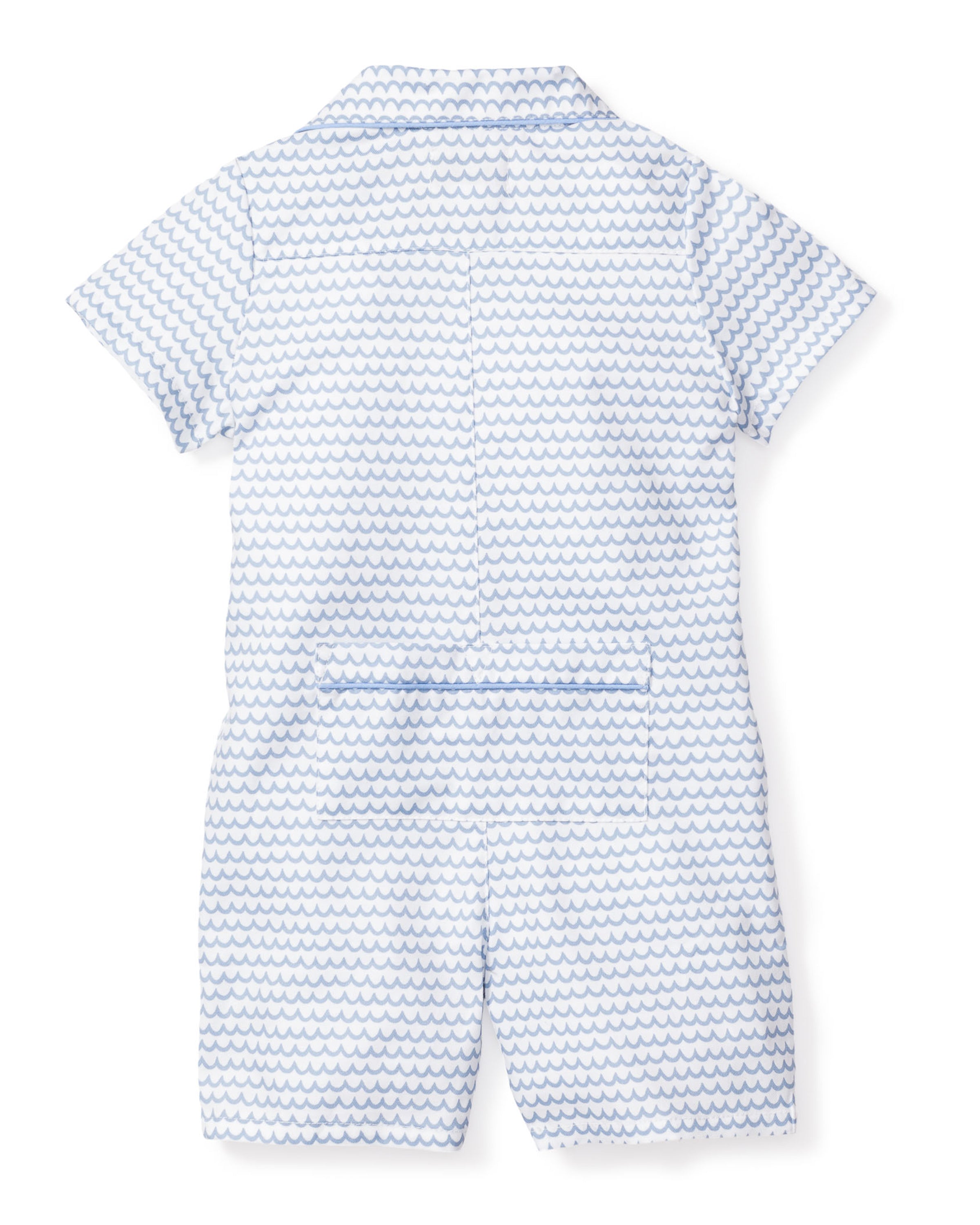 The Babys Twill Summer Romper in La Mer by Petite Plume is a short-sleeved childrens romper with a light blue wave pattern on white. Made of brushed twill, it includes a folded collar and horizontal seam at the waist on the back.